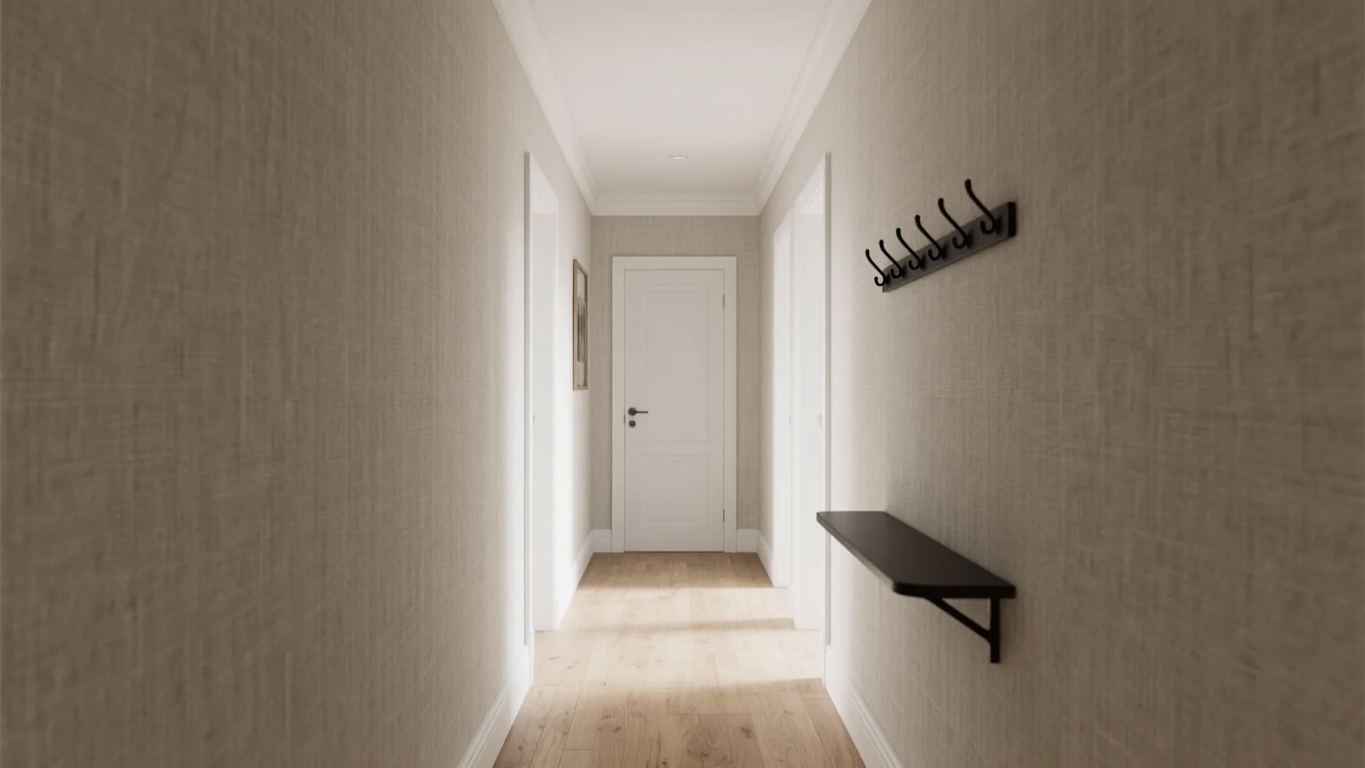 Long hallway with neutral textured wallpaper wooden floor white door black wall hooks and shelf