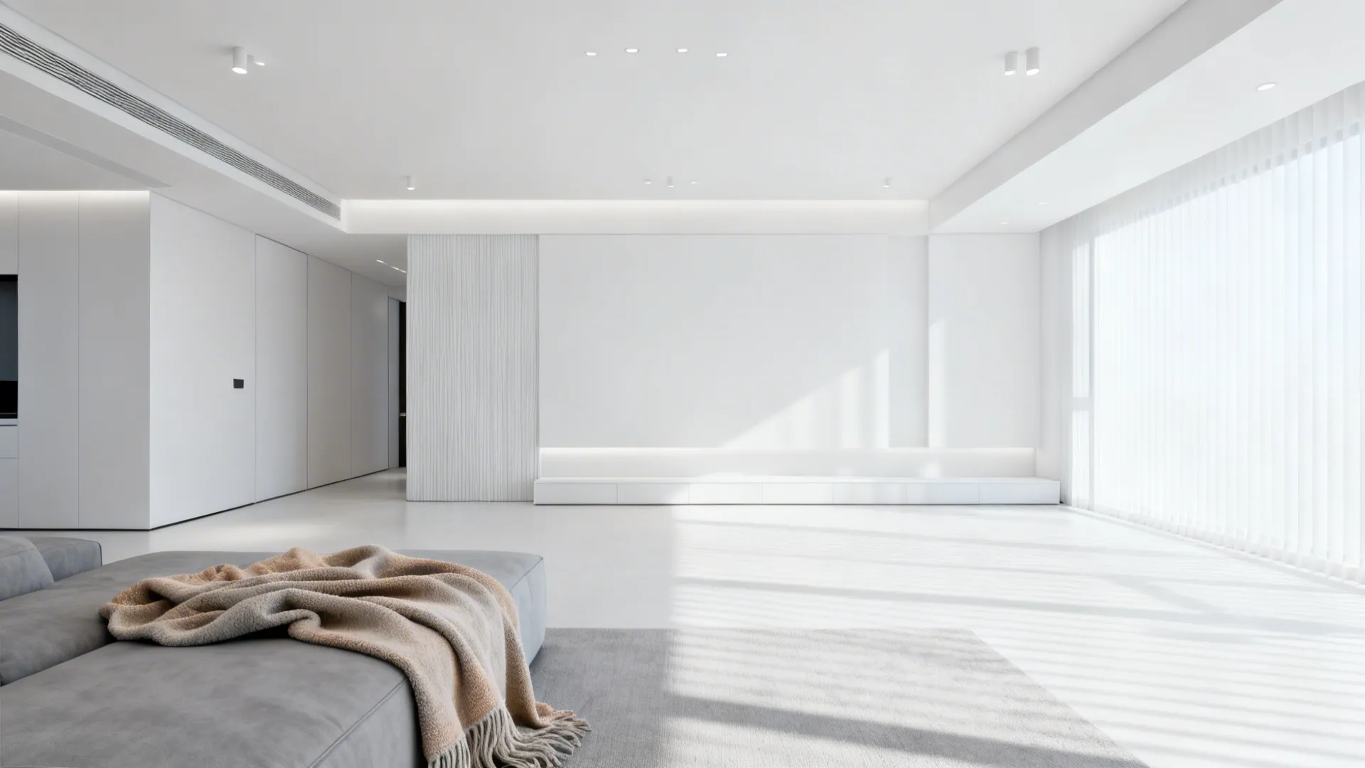 Minimalist living room with neutral white lighting emphasizing clean whites and cool grays.