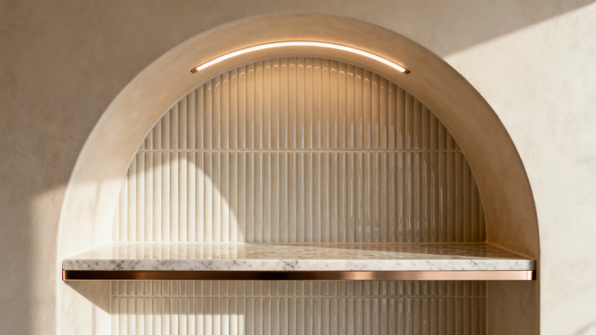 Macro of ribbed tile and LED glow inside an arched coffee niche with quartz shelf.