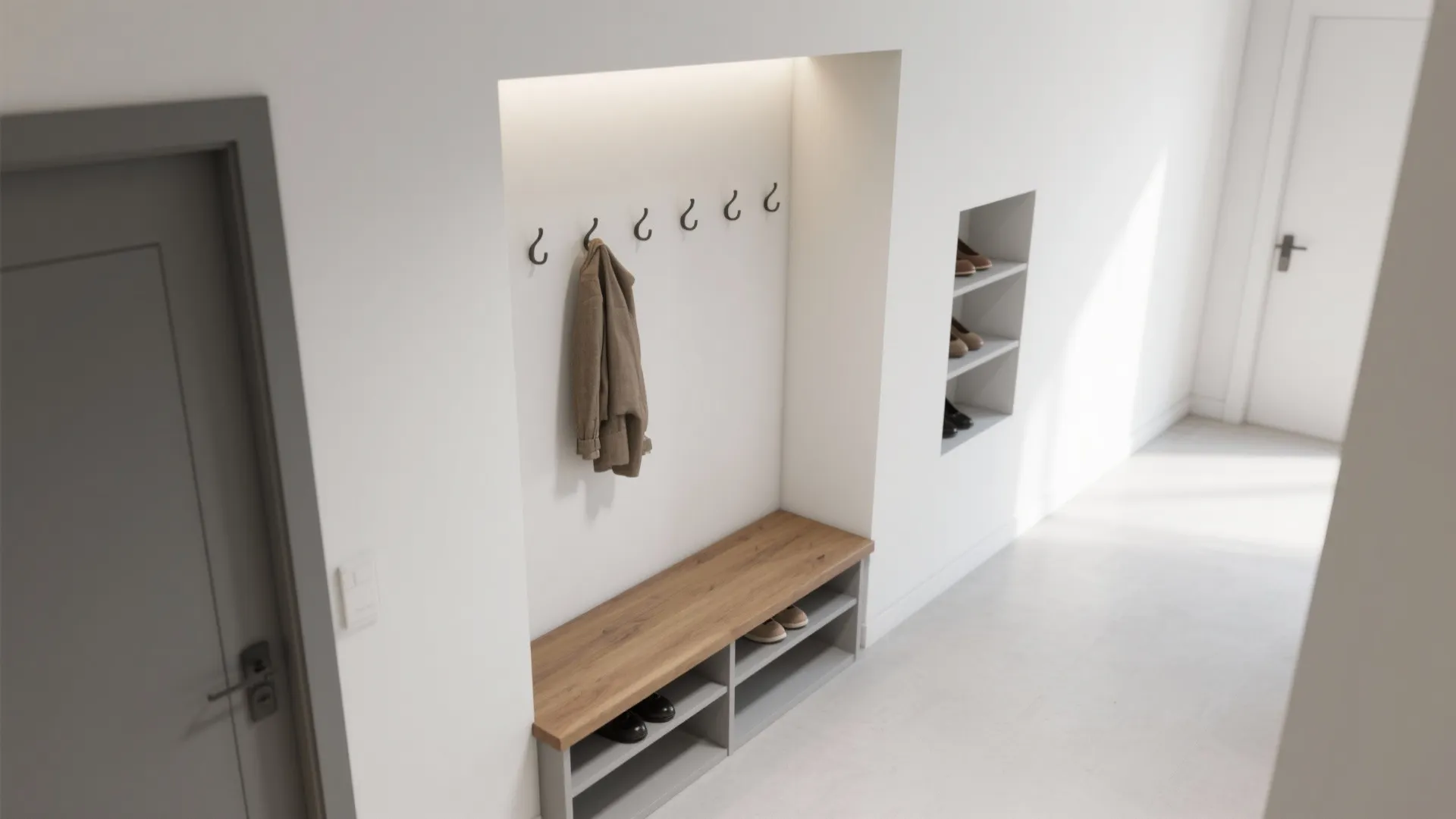 Entryway with wooden bench coat hooks and recessed wall shelves for shoes in bright hallway