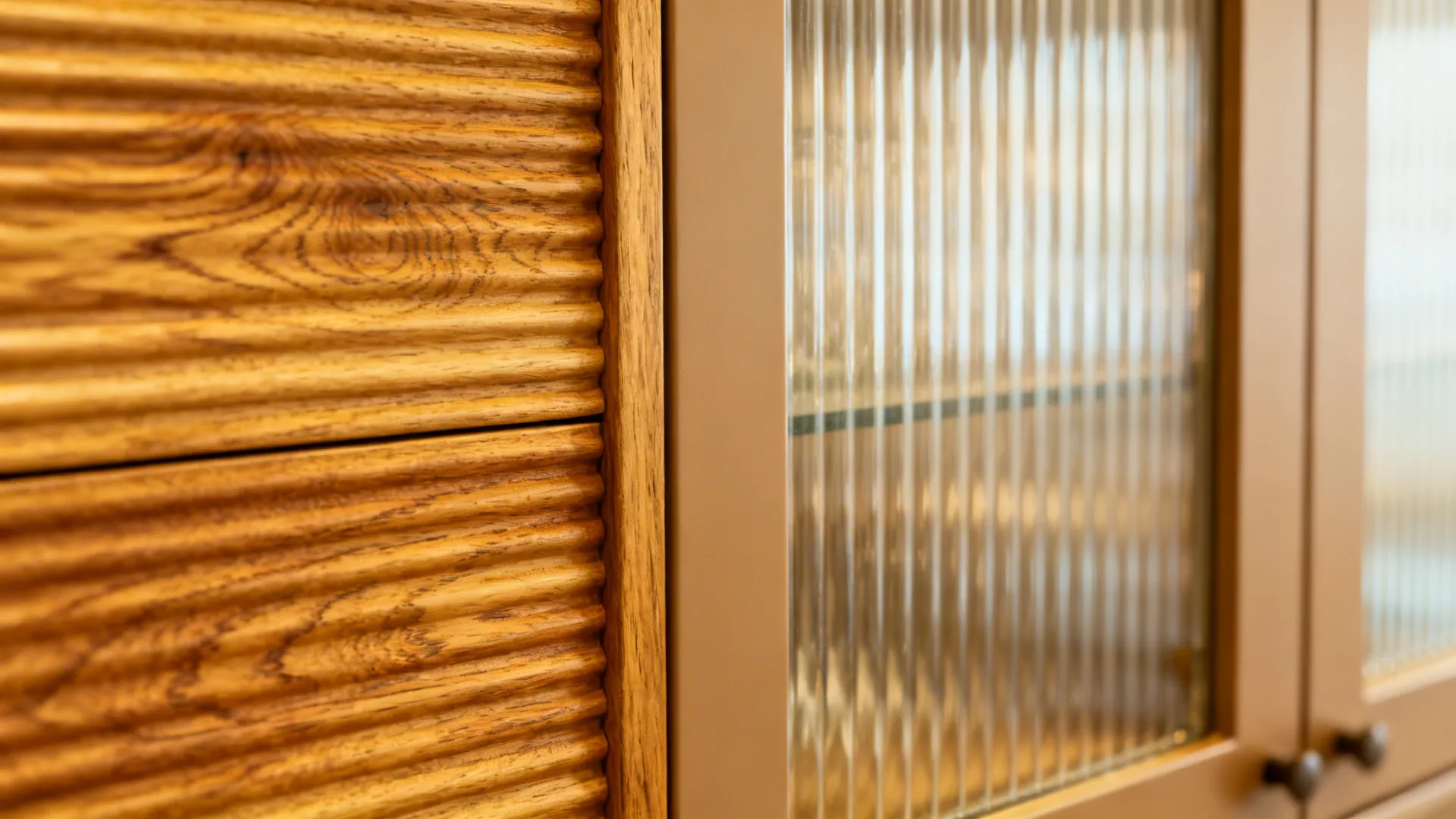 Macro of ribbed oak panel and fluted glass cabinet detail
