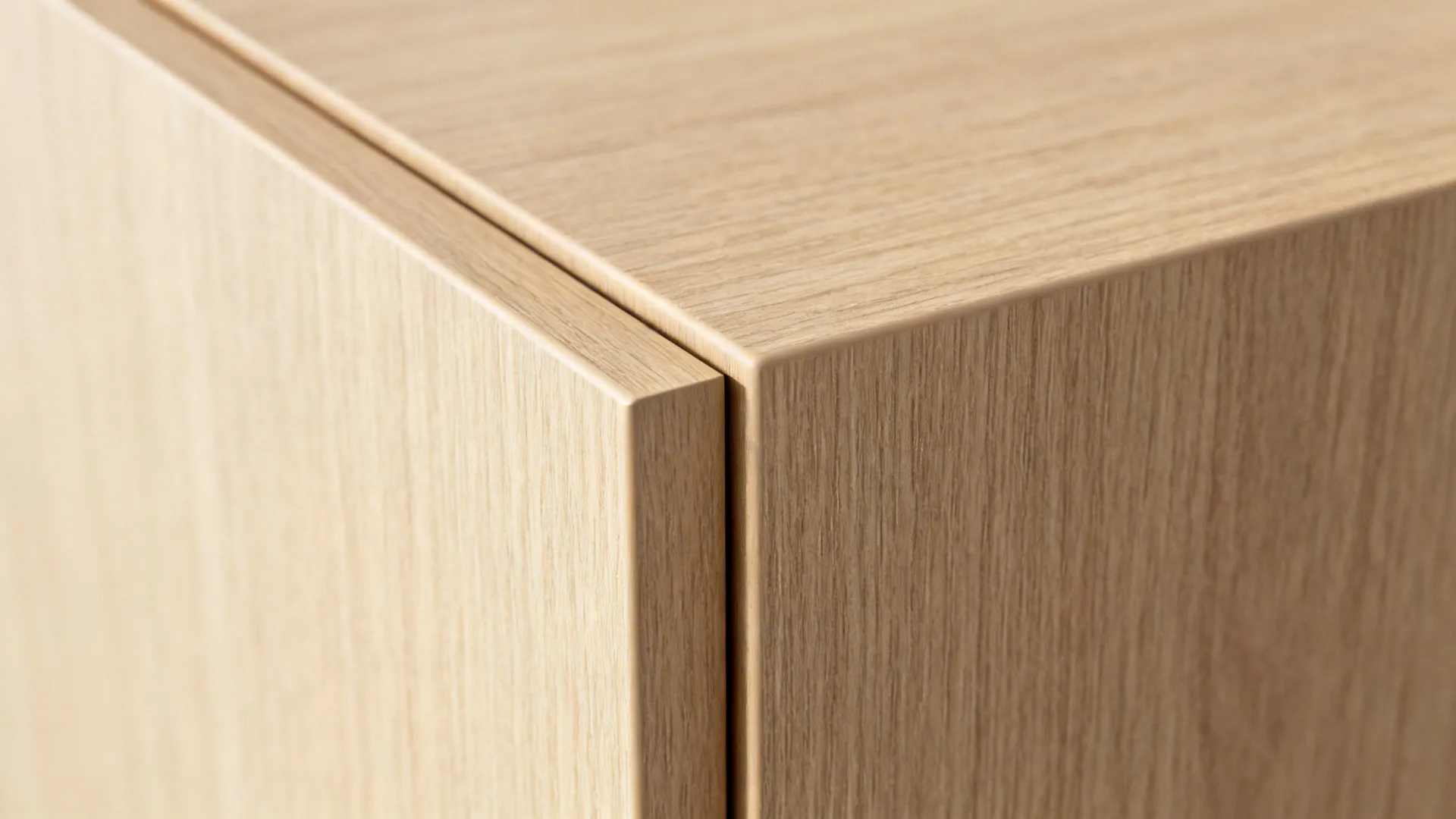 Close-up of pale oak-look laminate slab door with fine grain and matte finish.