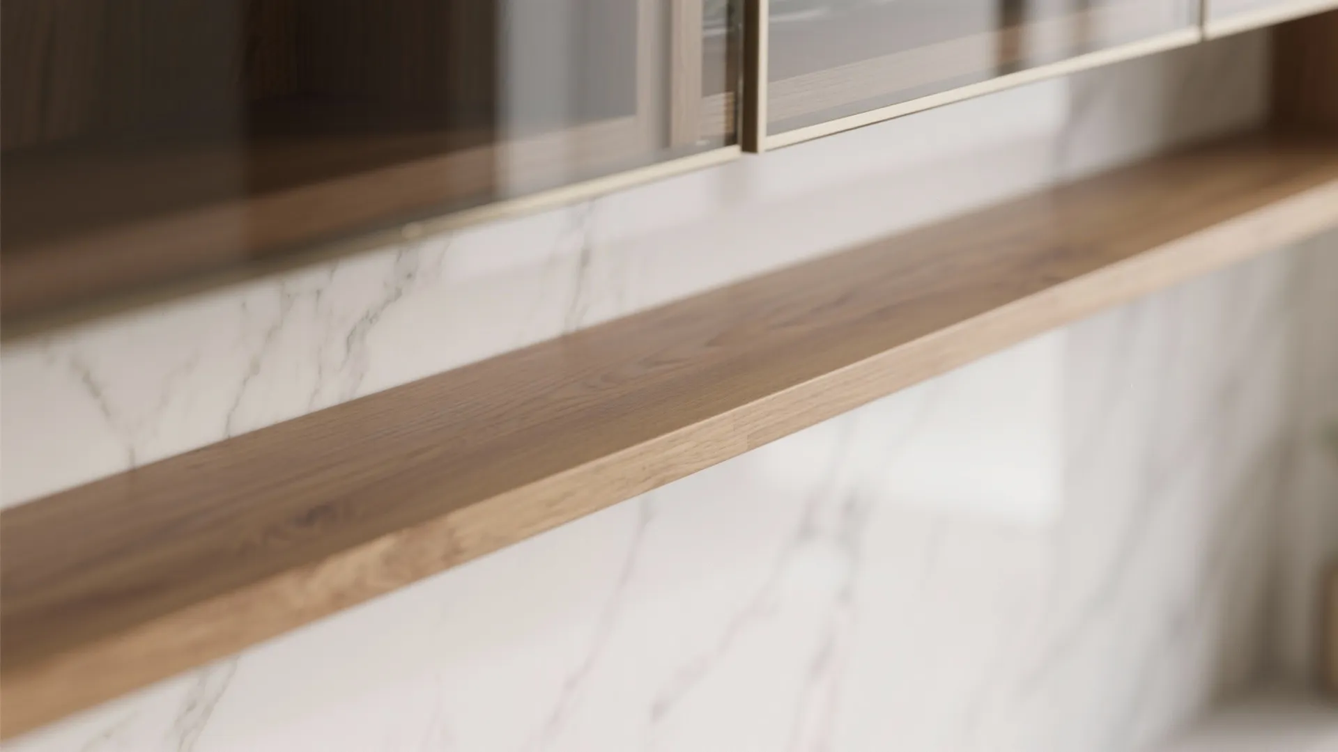Close up view of a natural wood floating shelf mounted against a white marble wall