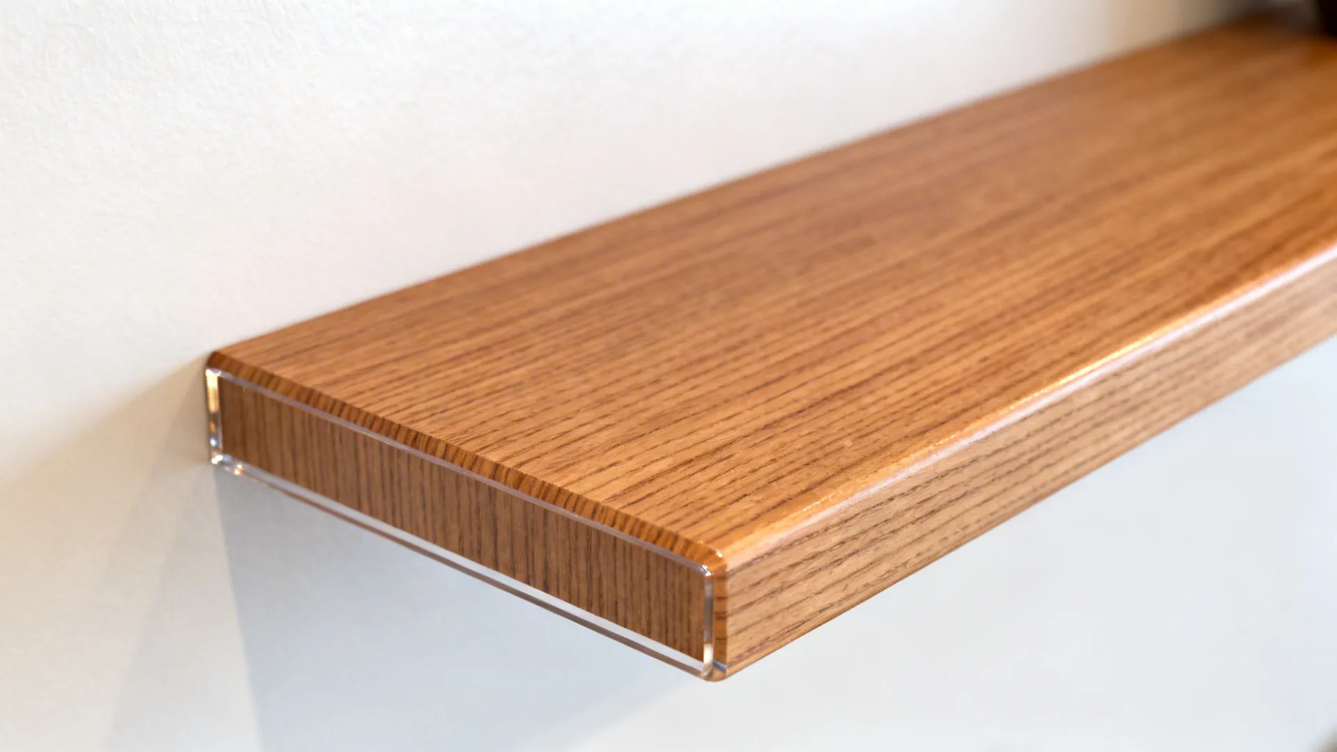 Close-up of rift-sawn oak shelf with sealed edge set against a matte white wall.
