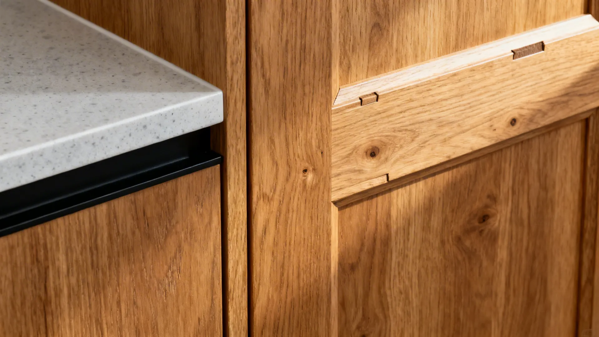 Macro of rift-sawn oak veneer beside pale quartz with a slim black edge in warm light.
