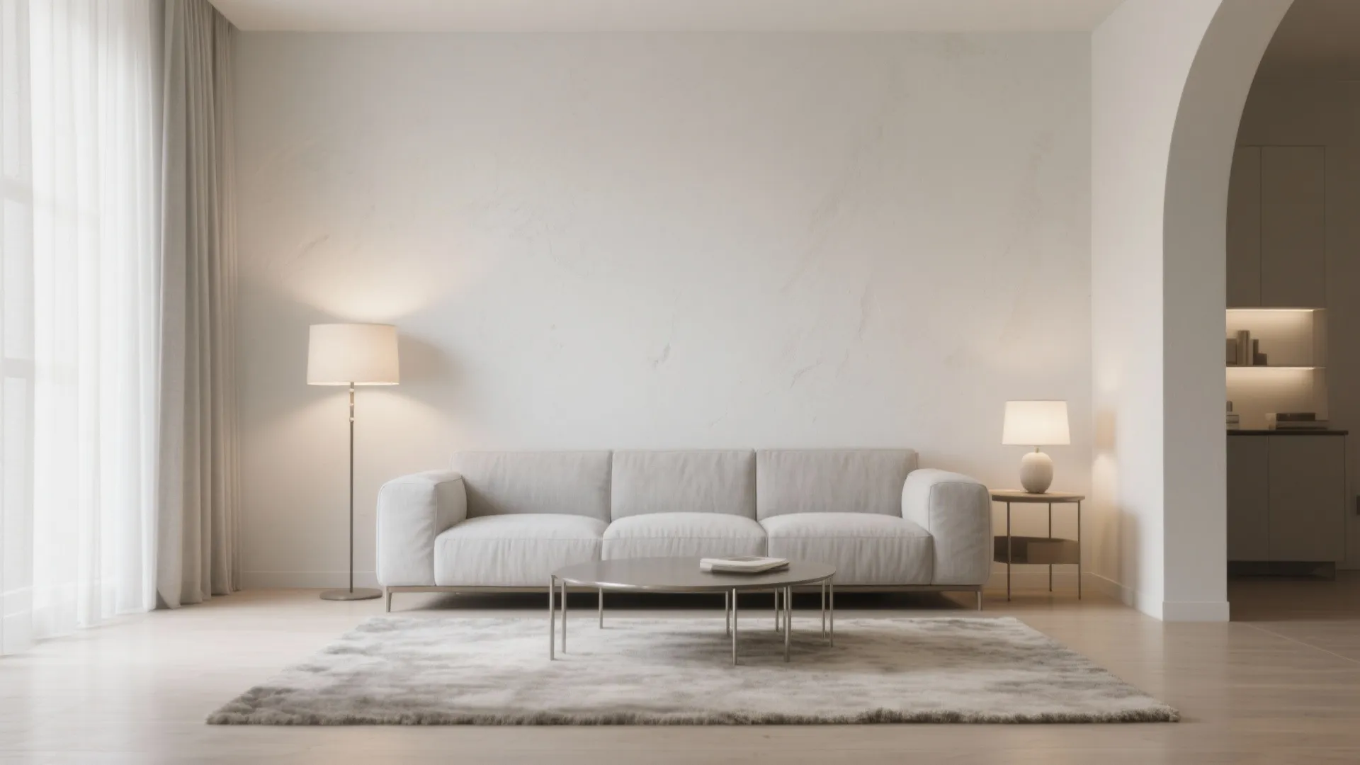 Modern living room with grey sofa round coffee table floor lamp and arched doorway entry