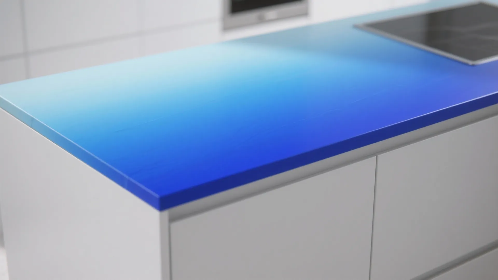 Ombre blue countertop fading from pale to deep blue on a white cabinet island, contemporary design.