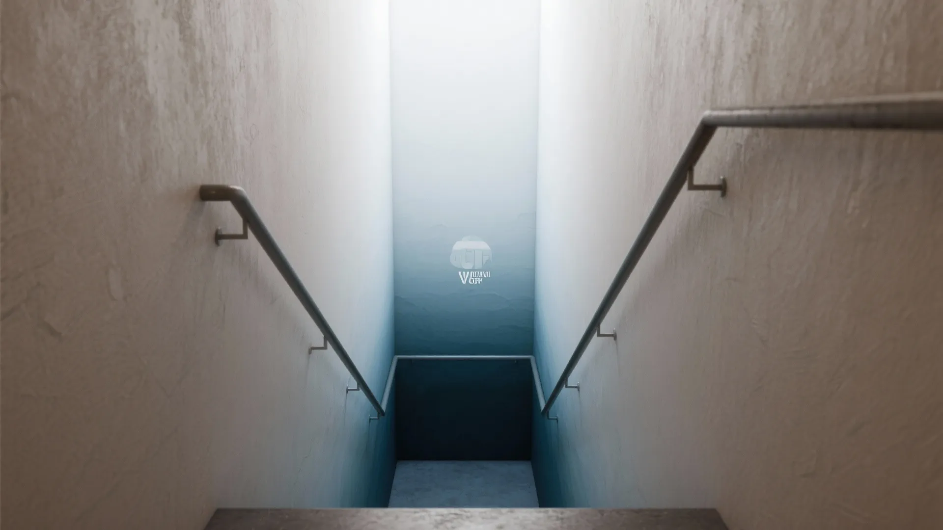 Looking down narrow staircase with blue ombre wall paint and metal handrails on white walls