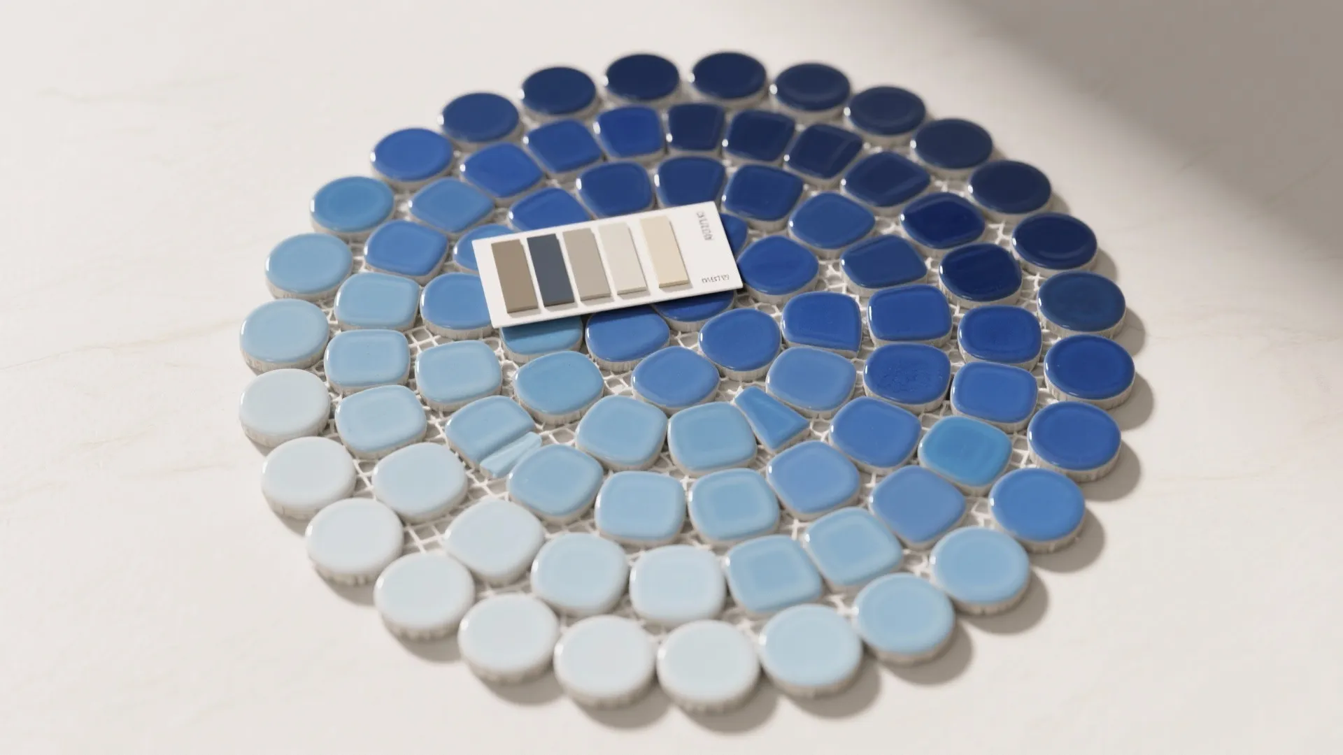 Circular arrangement of small blue tiles showing color gradient from light to dark with card