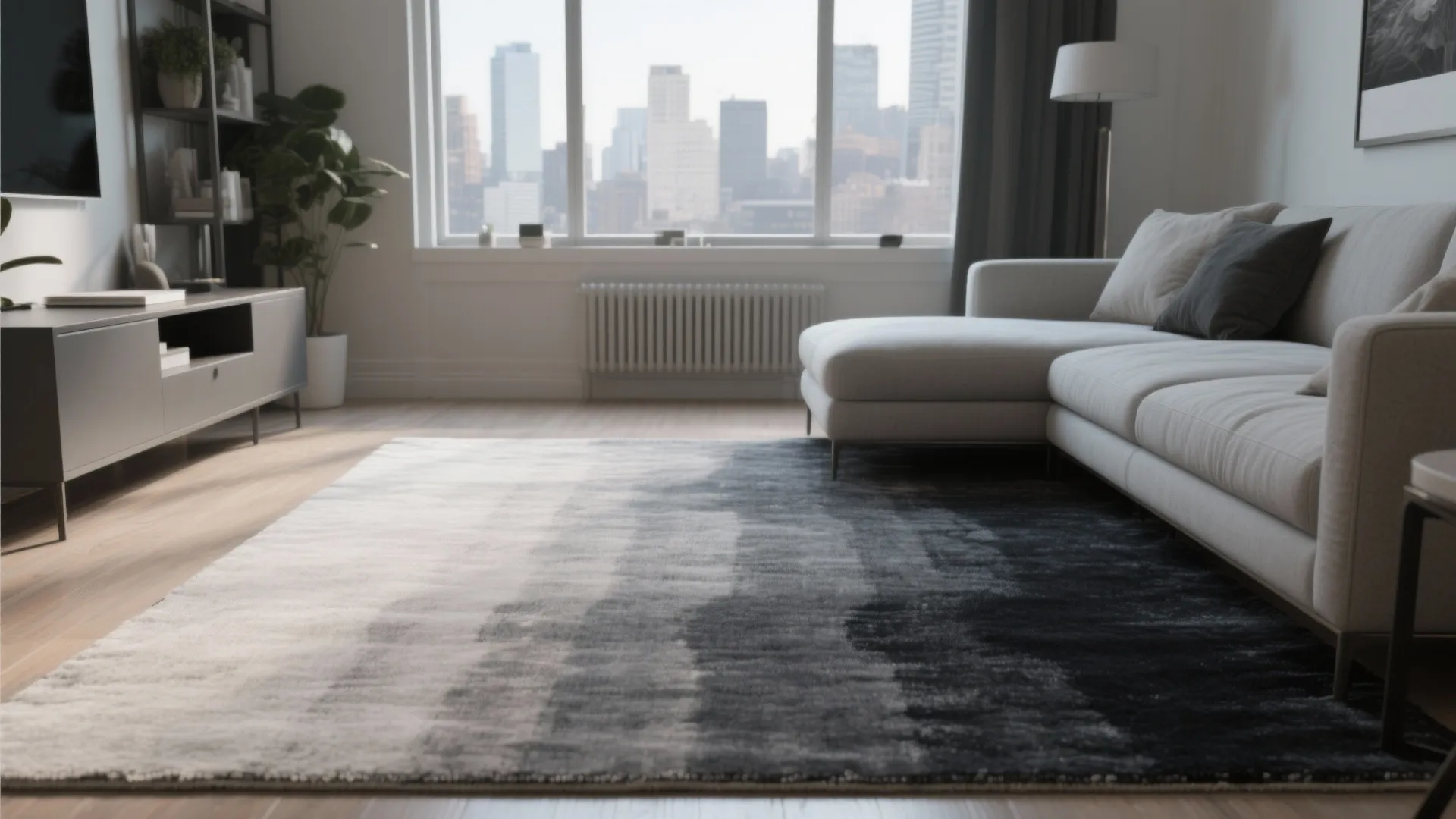 City apartment living room with an ombre rug from light grey to charcoal directing sight to the window.