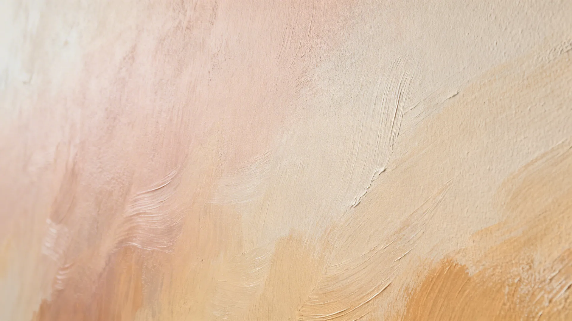 Close up detail of a wall mural showing soft brush strokes in pink peach and orange