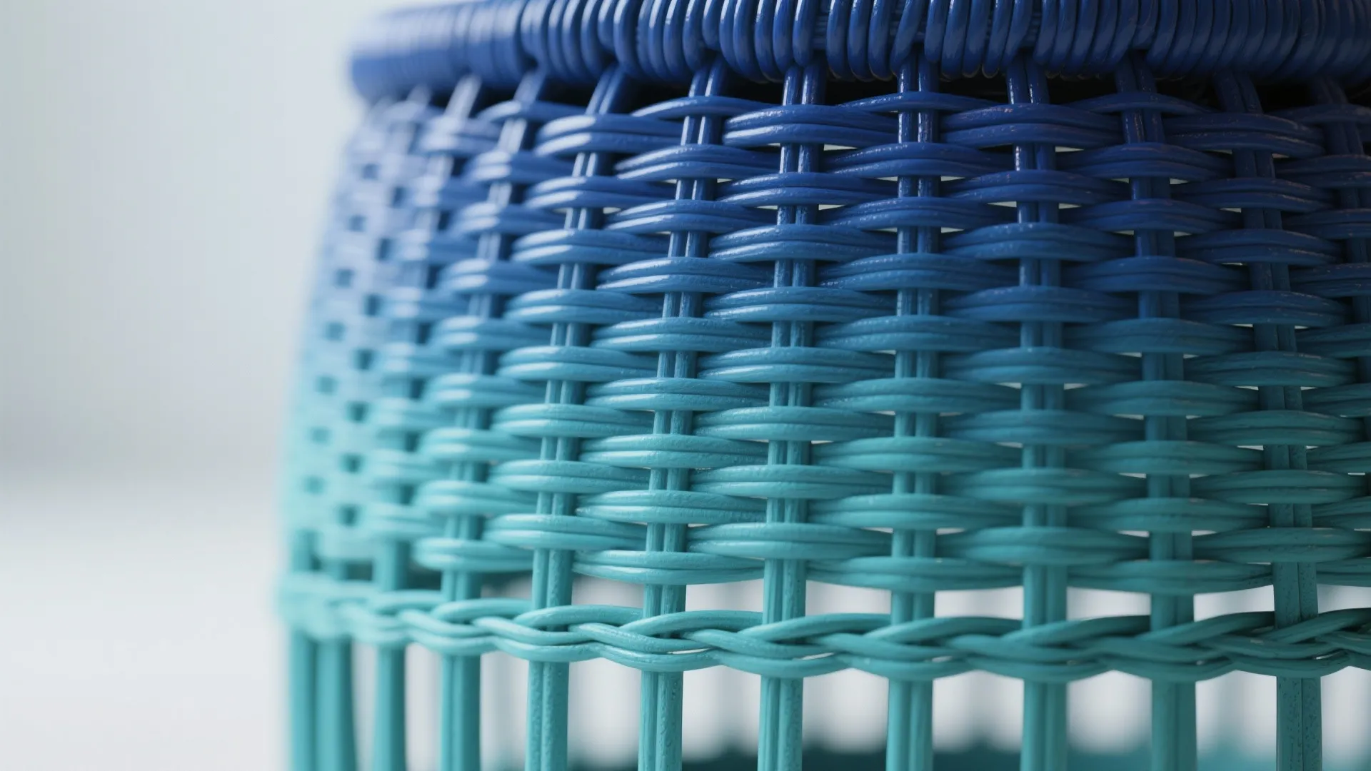 Ombre painted rattan stool fading from blue to teal