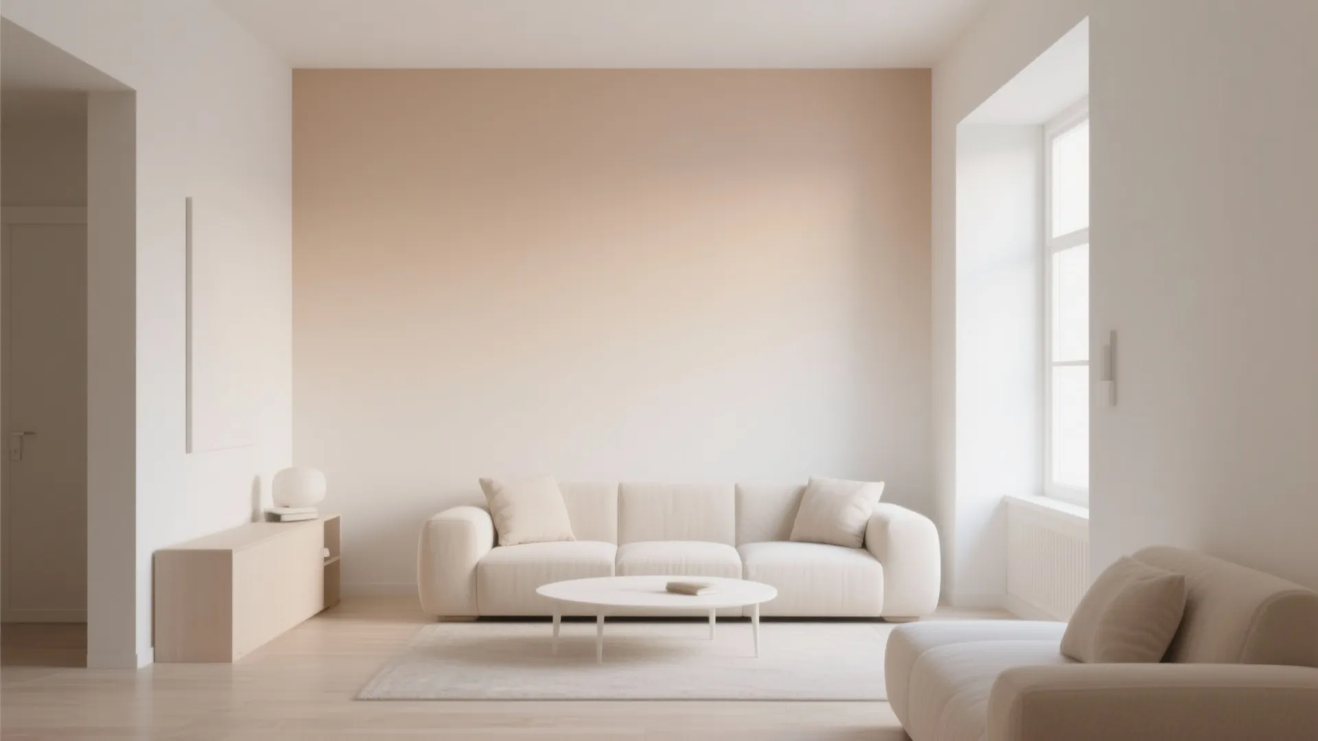 Modern living room showing peach ombre wall behind white sofa and round white coffee table
