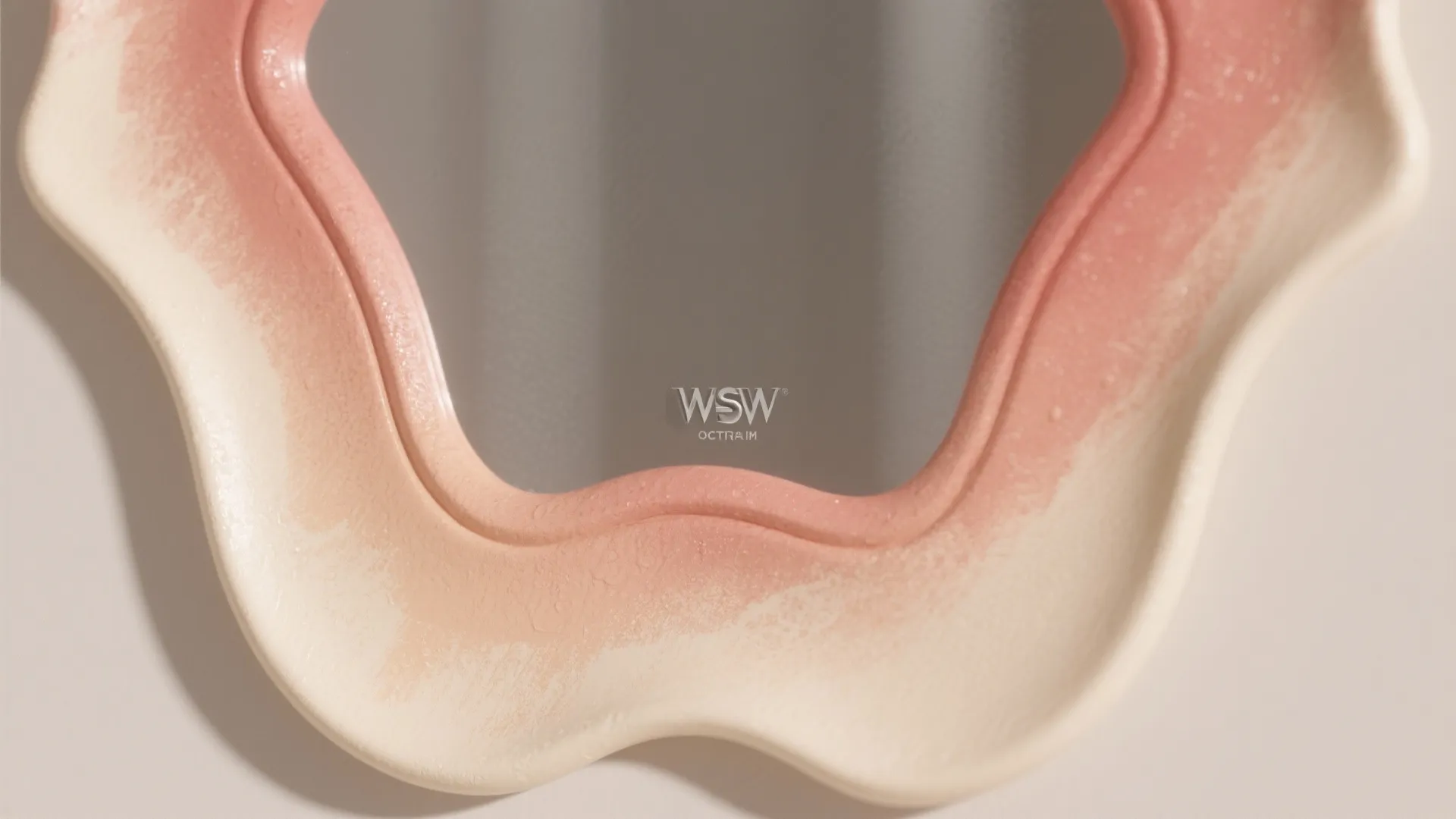 Close-up of a mirror frame showing a smooth soft ombre wash blending multiple tones with subtle texture.