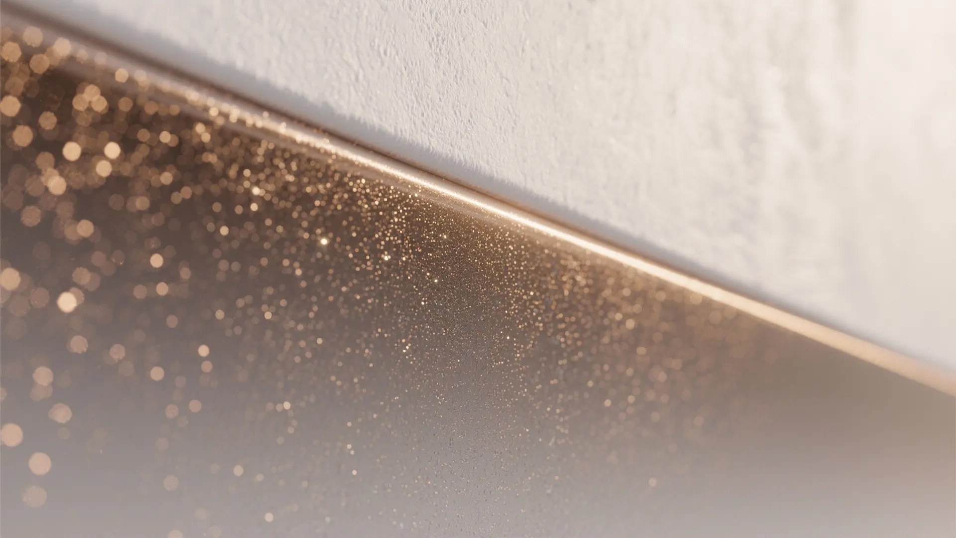 Close-up of a subtle metallic ombré wall showing fine airbrushed gradient and metallic flakes.