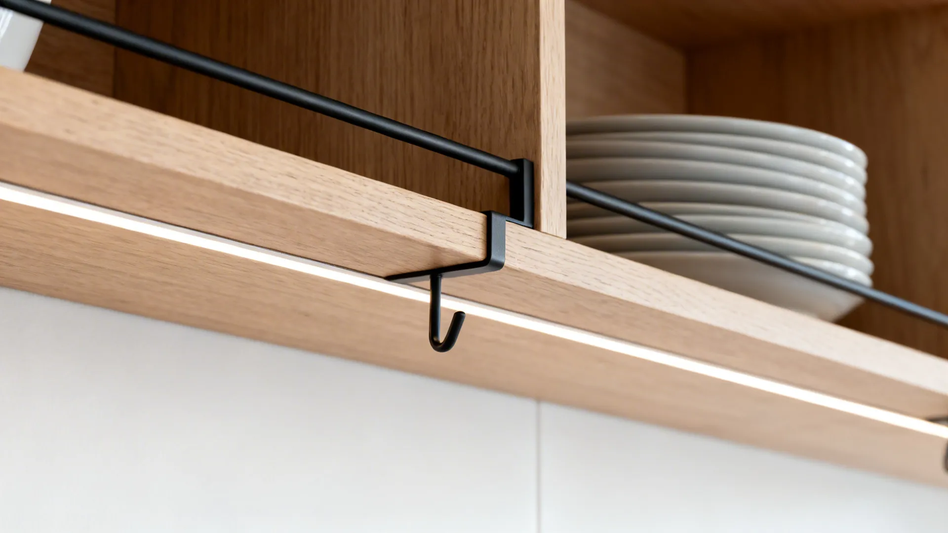 Macro close-up of wood shelf with black rail and under-shelf LED glow showing fine textures.