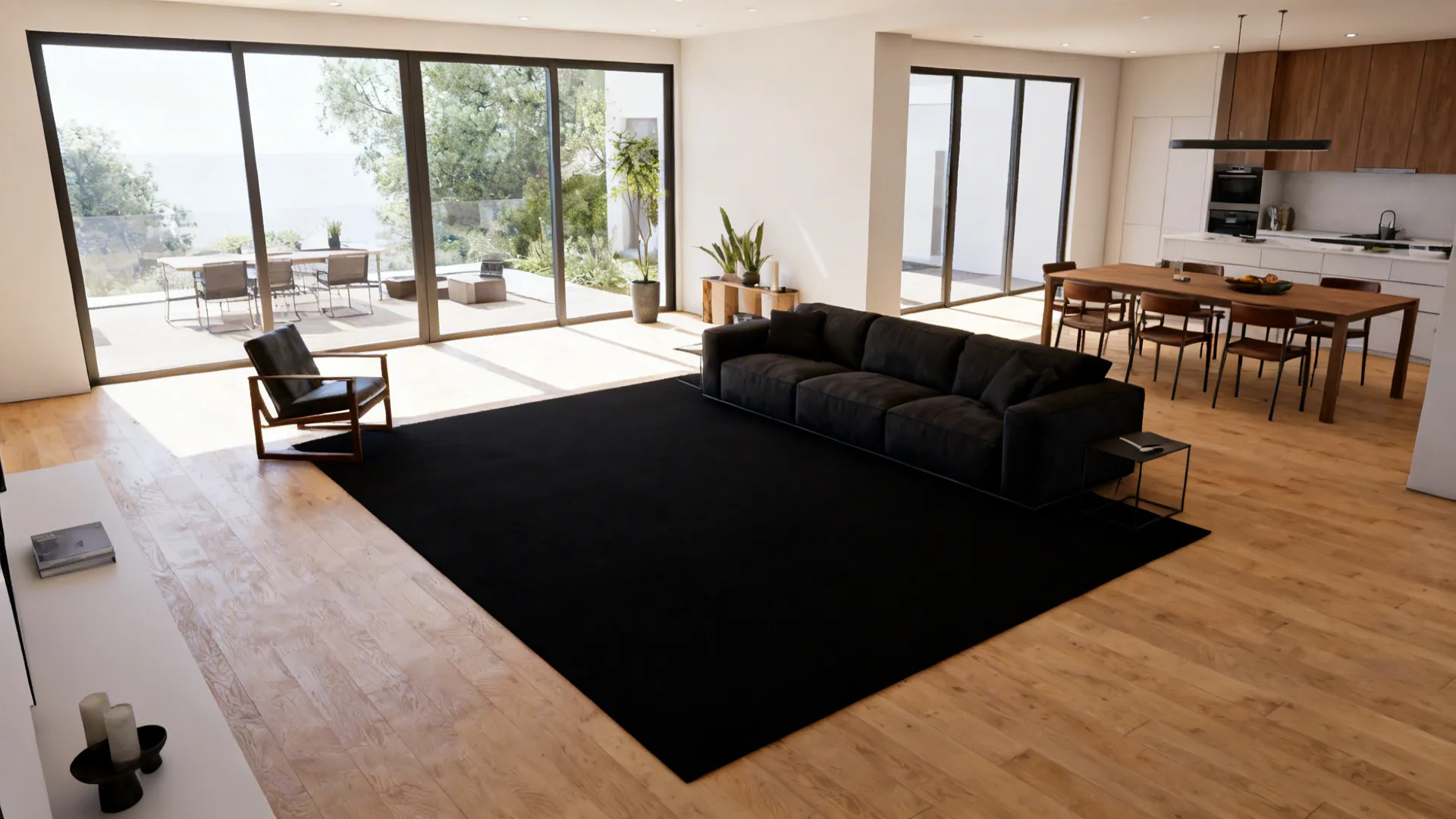 Open-plan living-dining room with a rectangular black rug defining the seating zone under a sofa