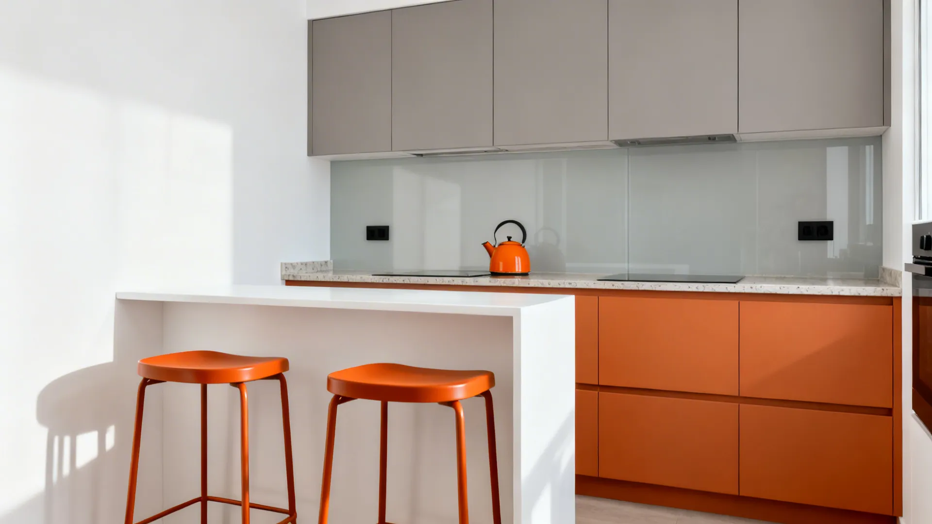 Minimalist small kitchen with matte orange stools, an orange kettle, and clean white and greige finishes.