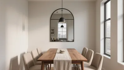 Modern Dining Room with Arched Mirror and Natural Light