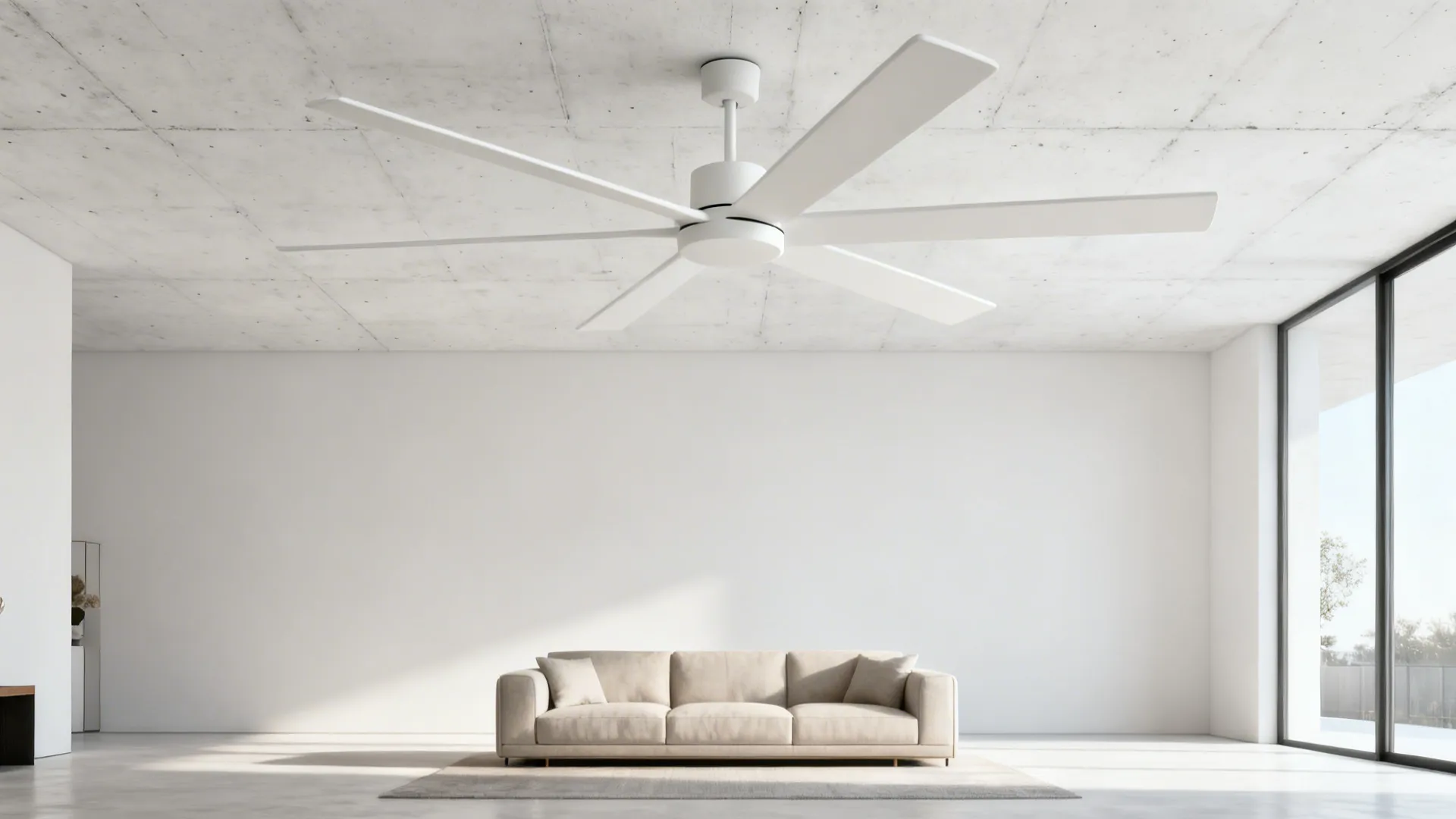 Clean contemporary living room with a large matte white ceiling fan and minimalist decor.