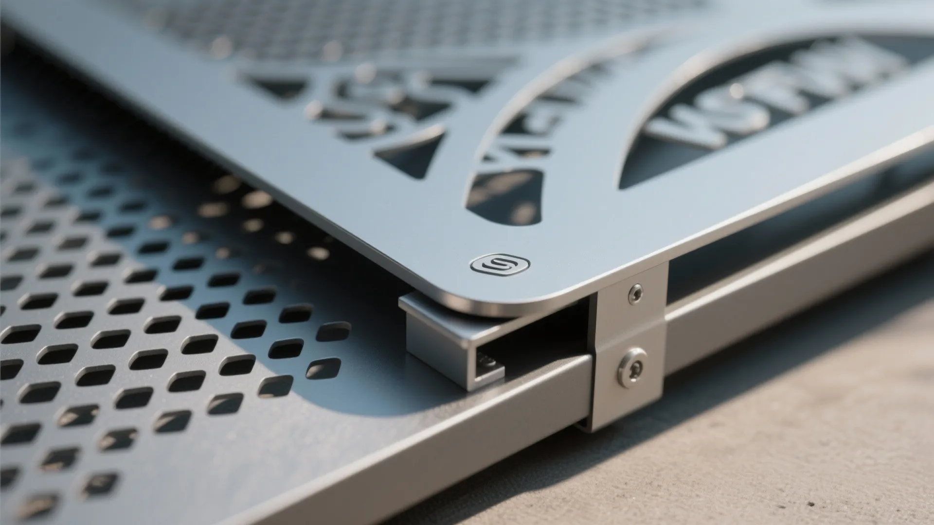 Macro of laser-cut aluminum panel with smooth edge and semi-gloss coating.