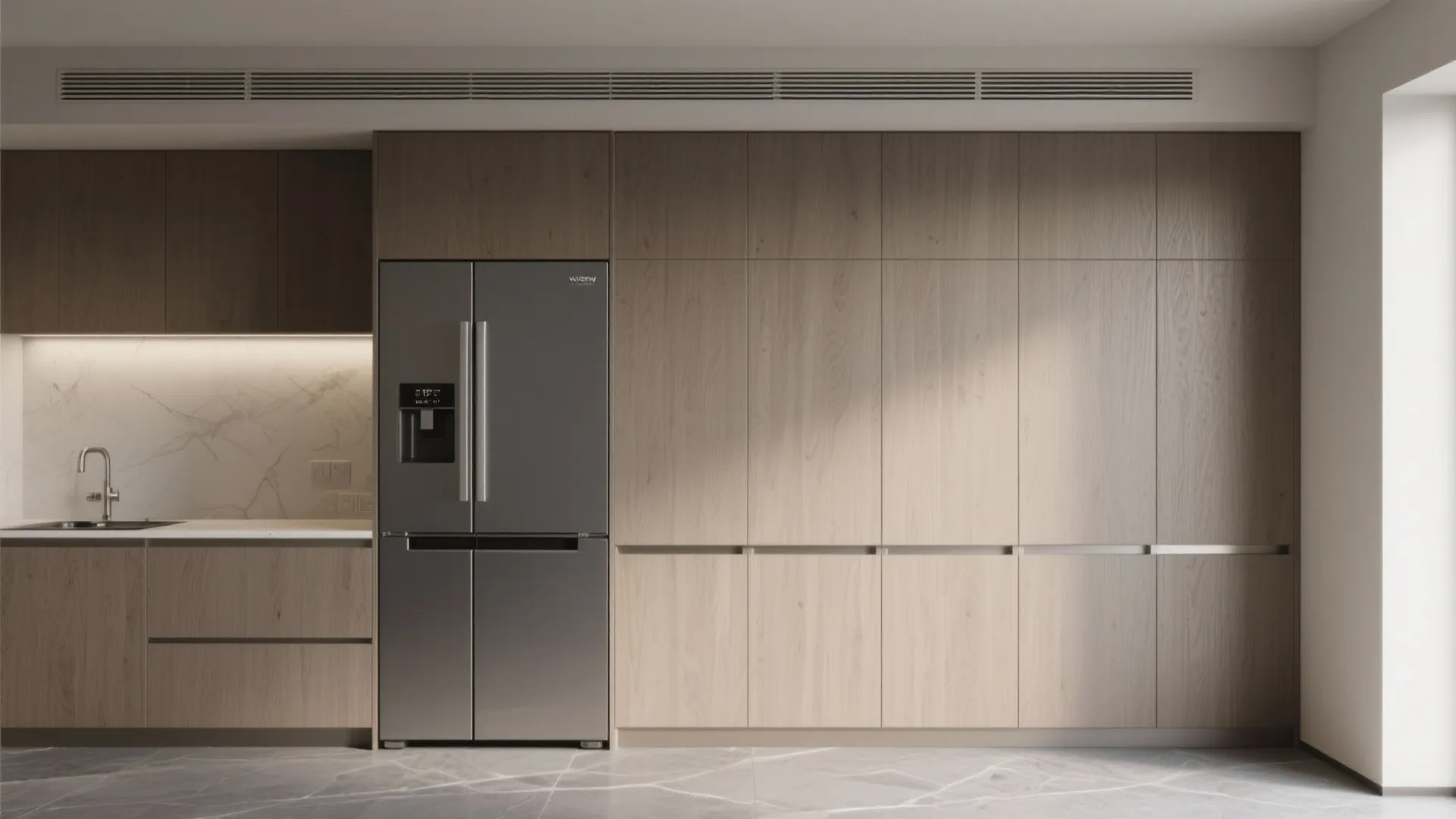 Minimalist kitchen wall with a panel-ready integrated fridge hidden behind matching wood cabinetry.