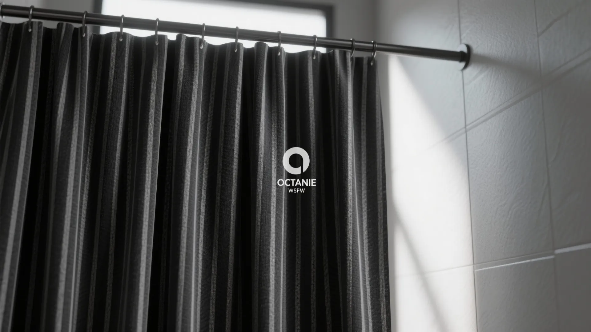Close up of a black striped curtain hanging on a metal rod against white tiles