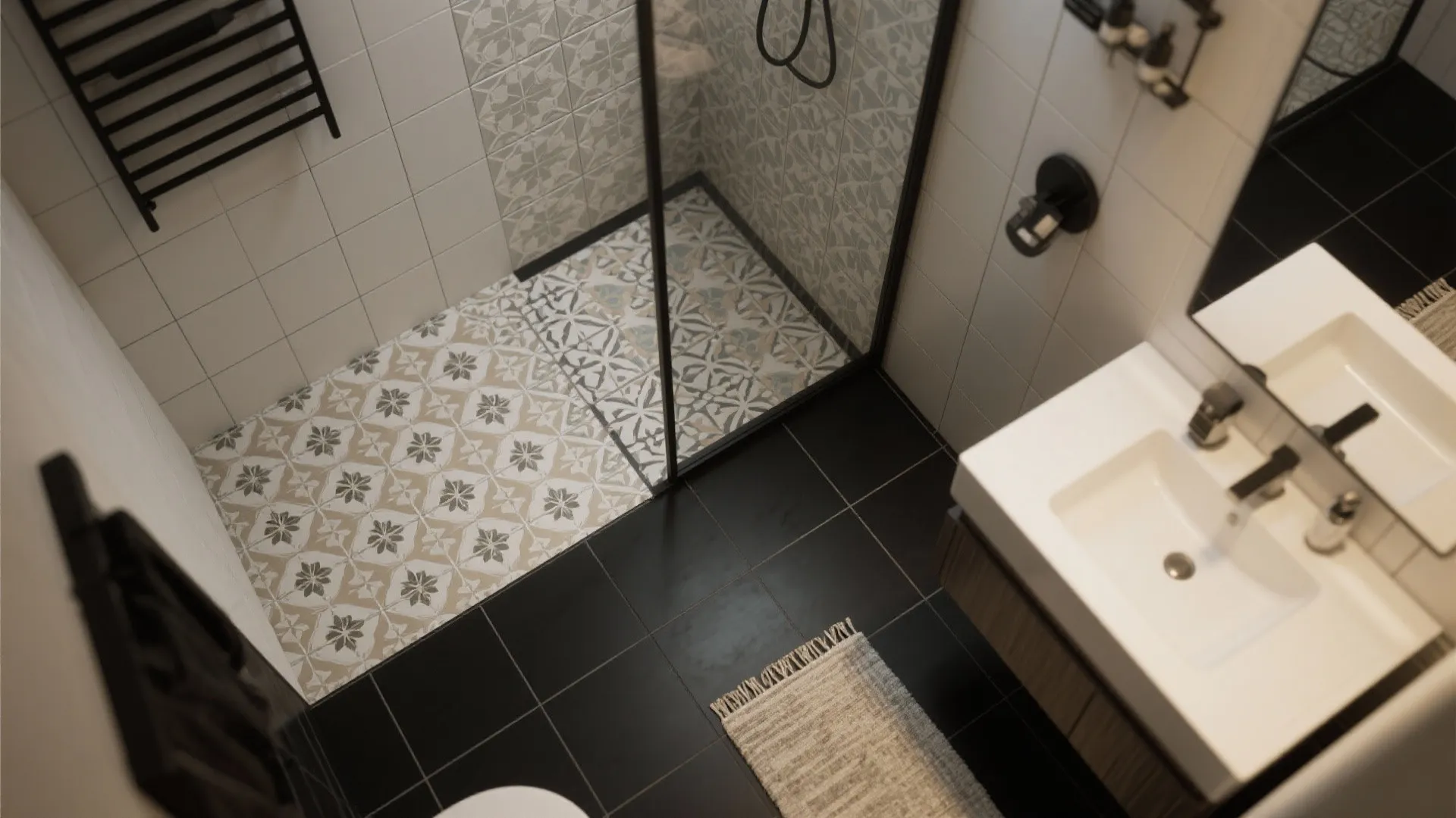 Patterned tile inset and small rug creating a zoned area beside matte black floor tiles