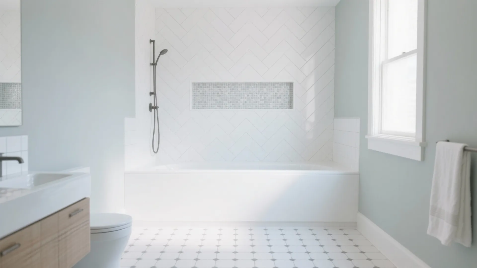 White hex floor with gray border and herringbone shower wall plus micro-mosaic niche.