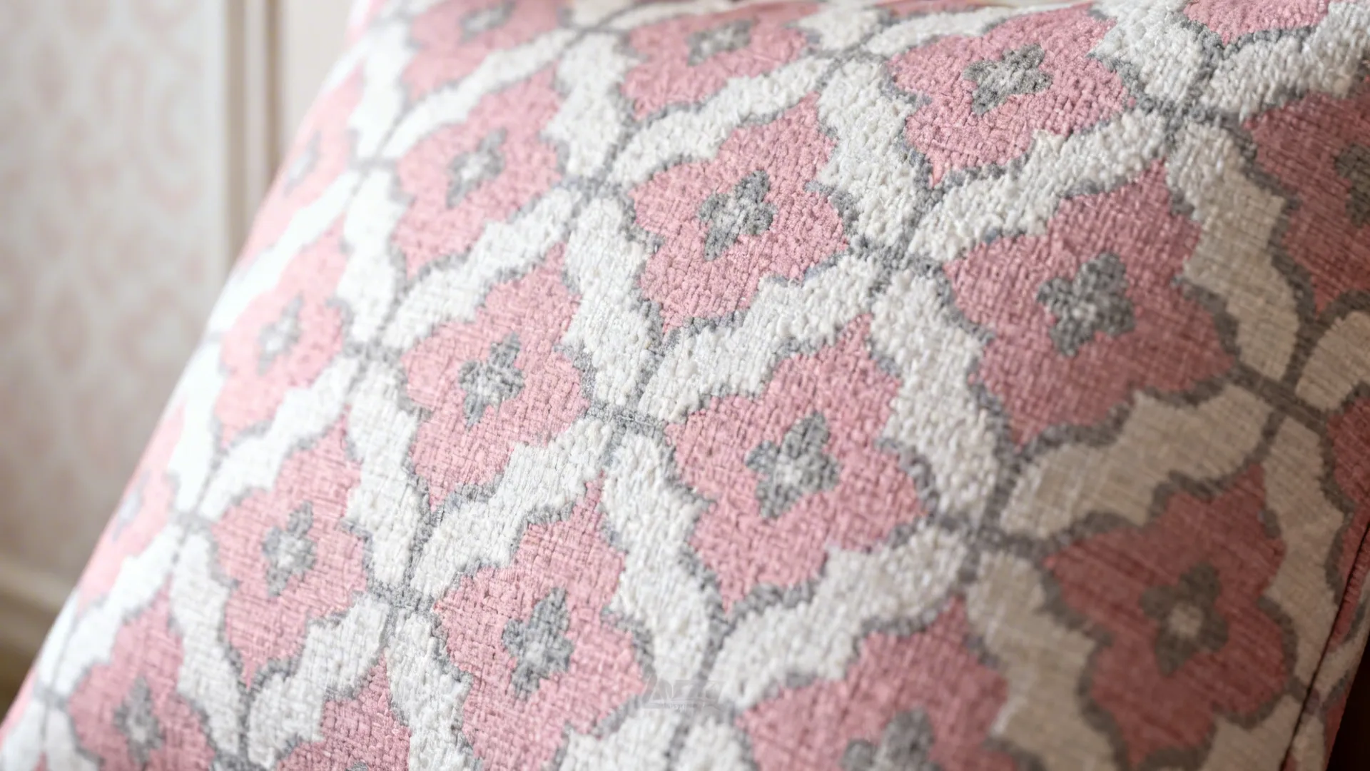 Close-up of pink, white and grey patterned fabric and wallpaper