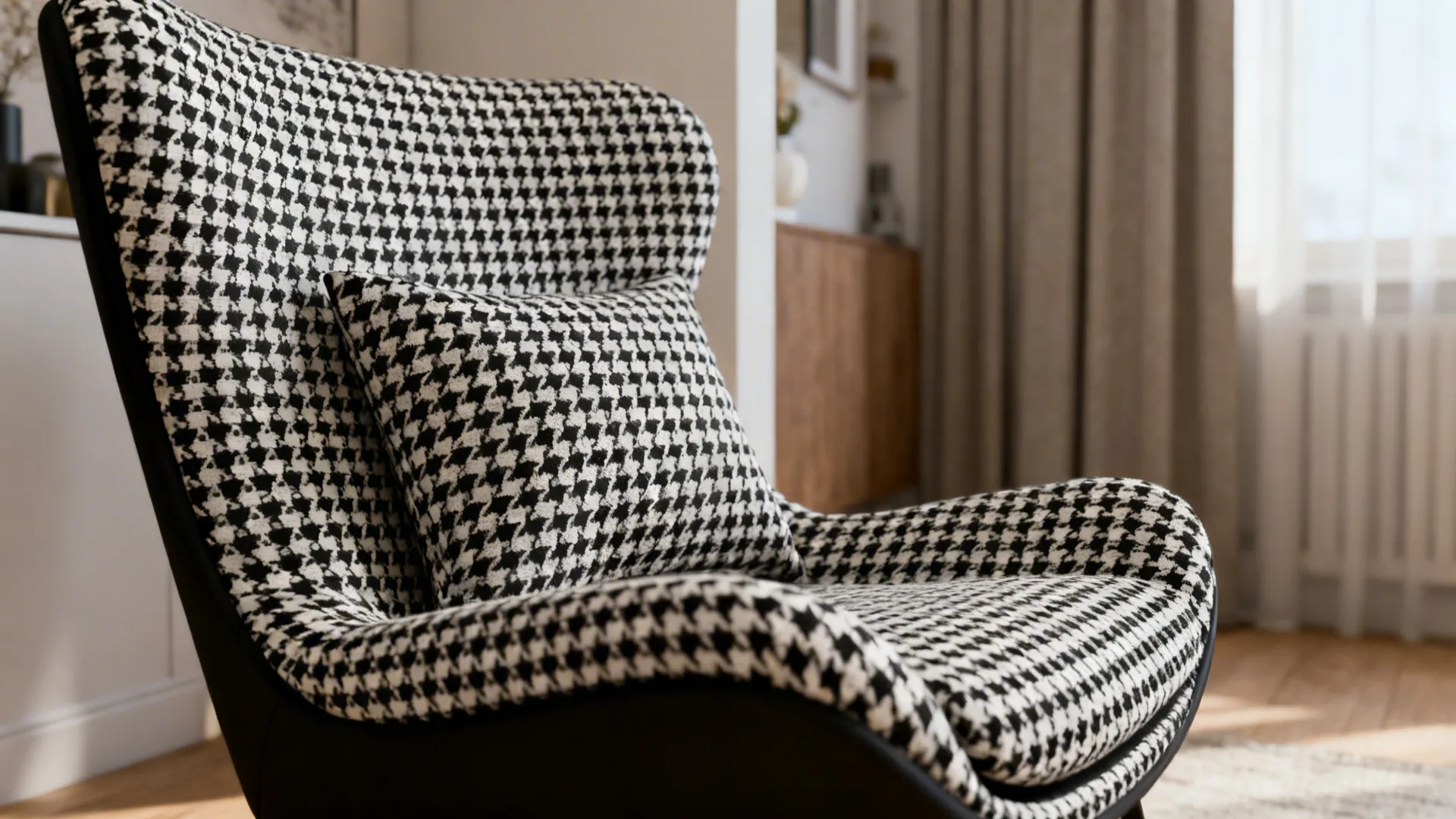 Close-up of black-and-white patterned accent chair in a small living room