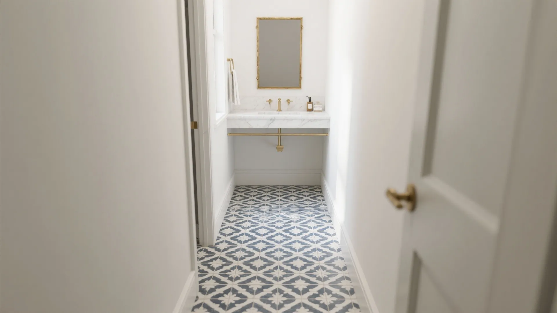 Narrow guest bath with muted navy and ivory patterned porcelain bathroom floor tiles