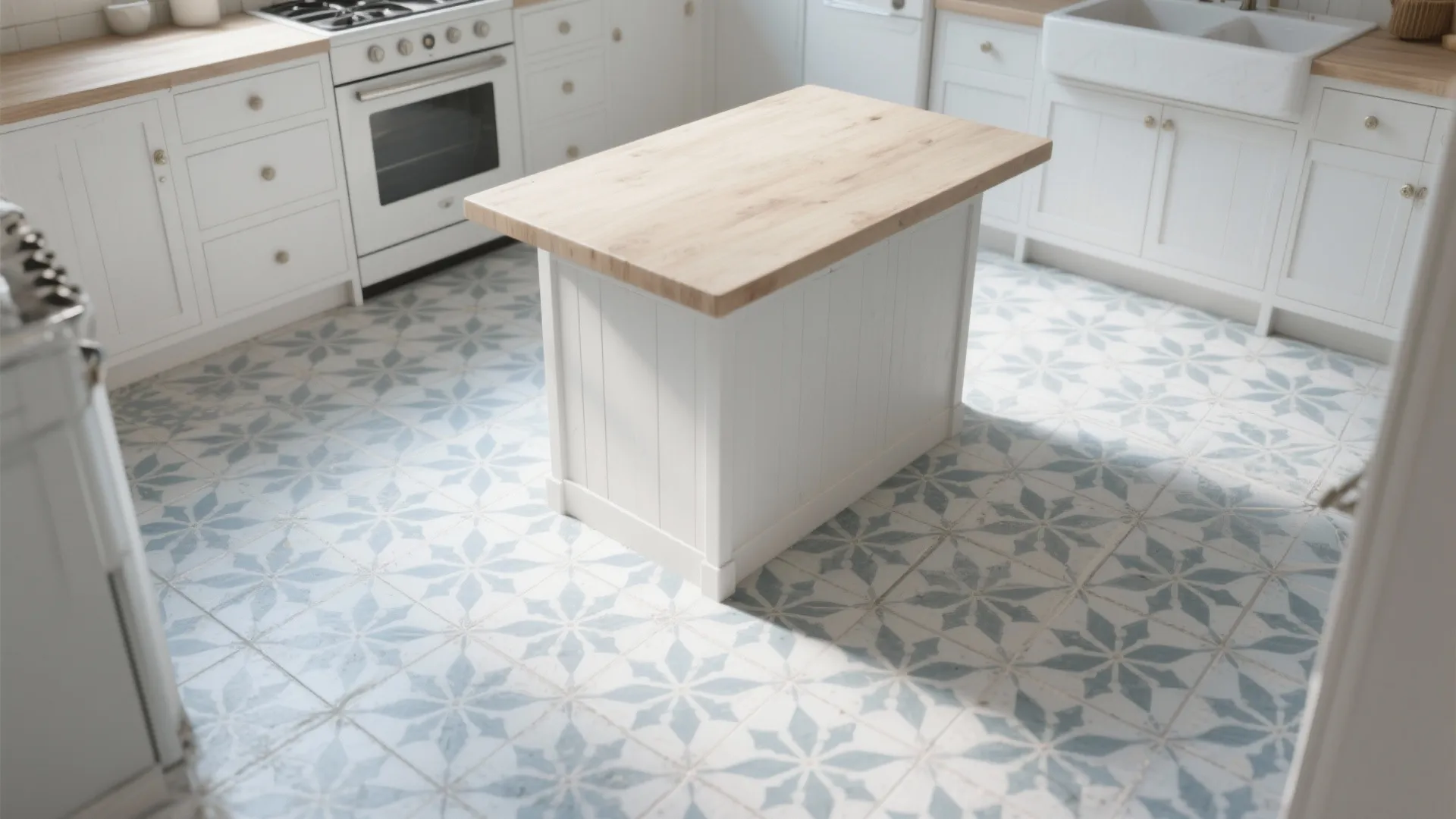 White kitchen cabinets with wooden island plus light blue floral patterned floor tiles in bright room