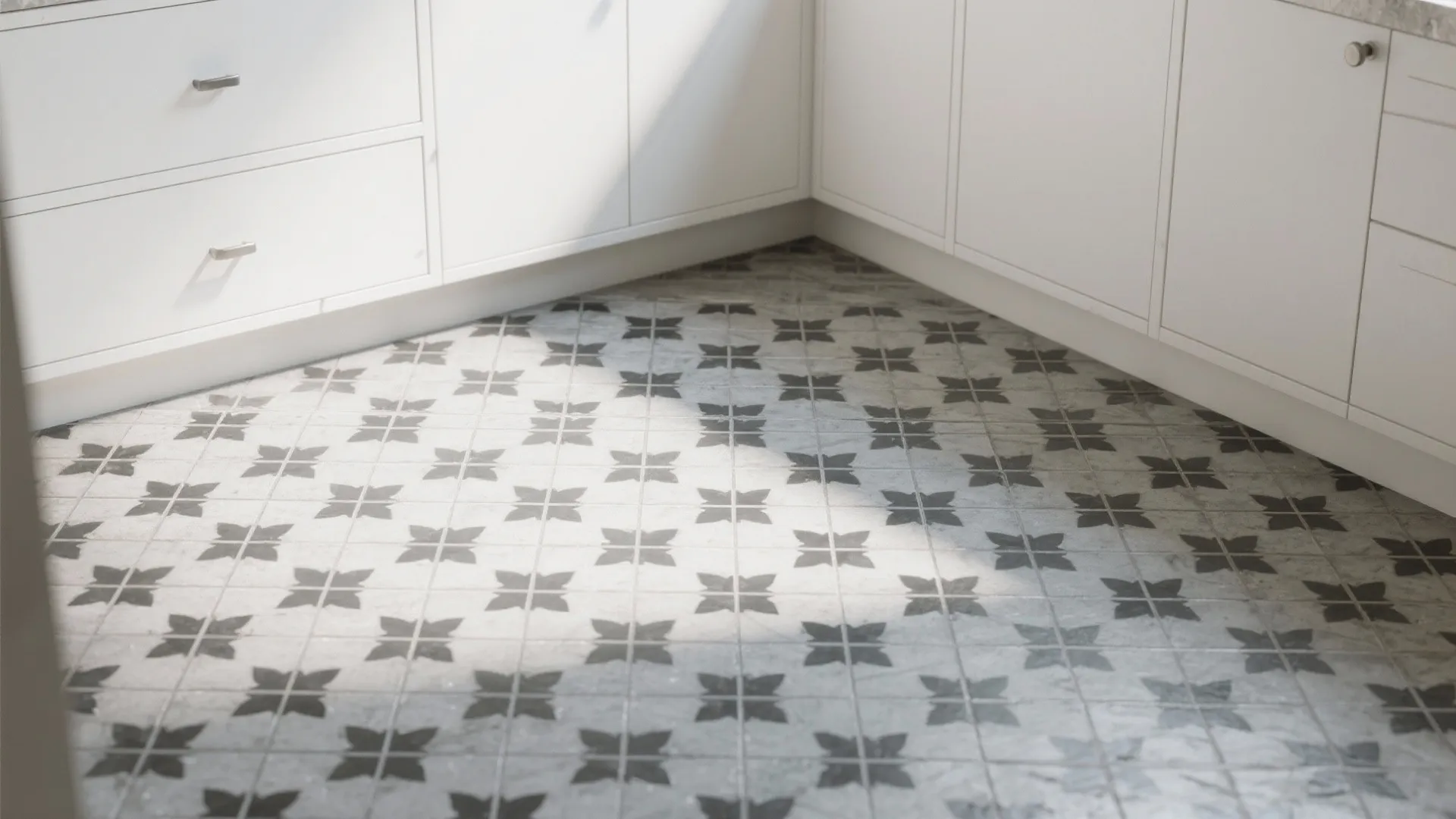 4. Monochrome Patterned Floor with Minimal White Cabinetry