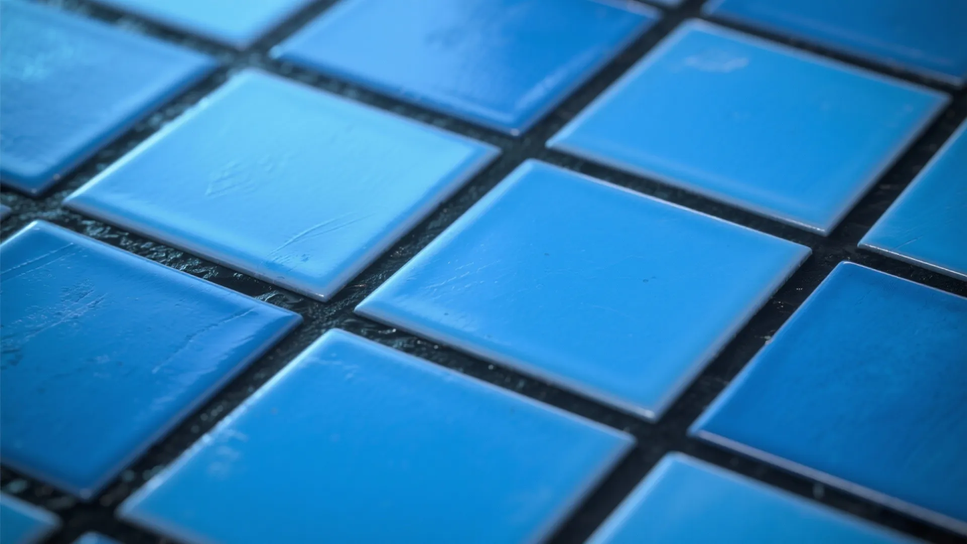 Close-up of blue subway tiles with dark charcoal grout for a graphic contemporary look