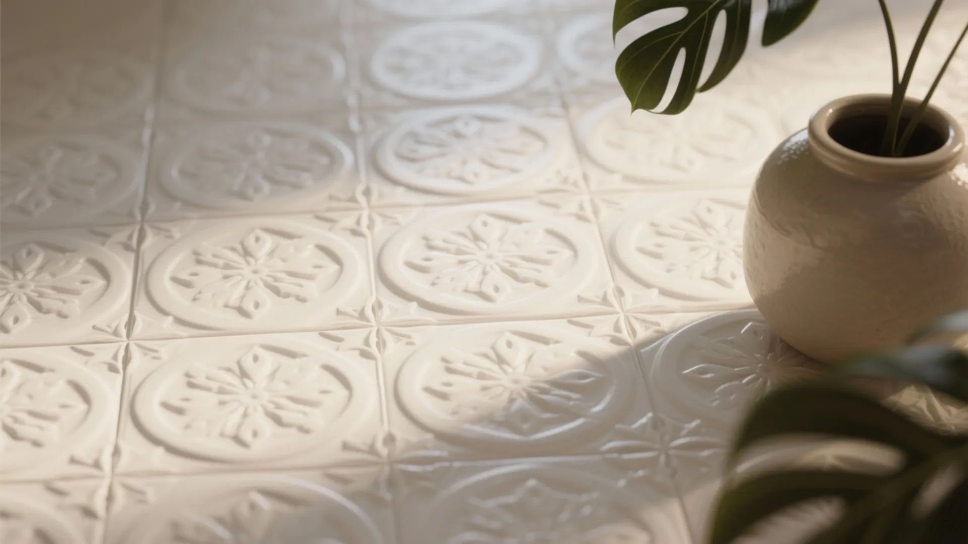 White-on-white patterned relief tiles showing subtle texture and shadow for tactile interest