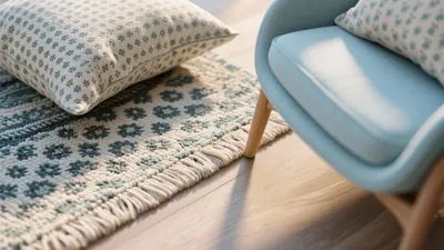 Cozy Blue Armchair with Floral Rug & Pillows