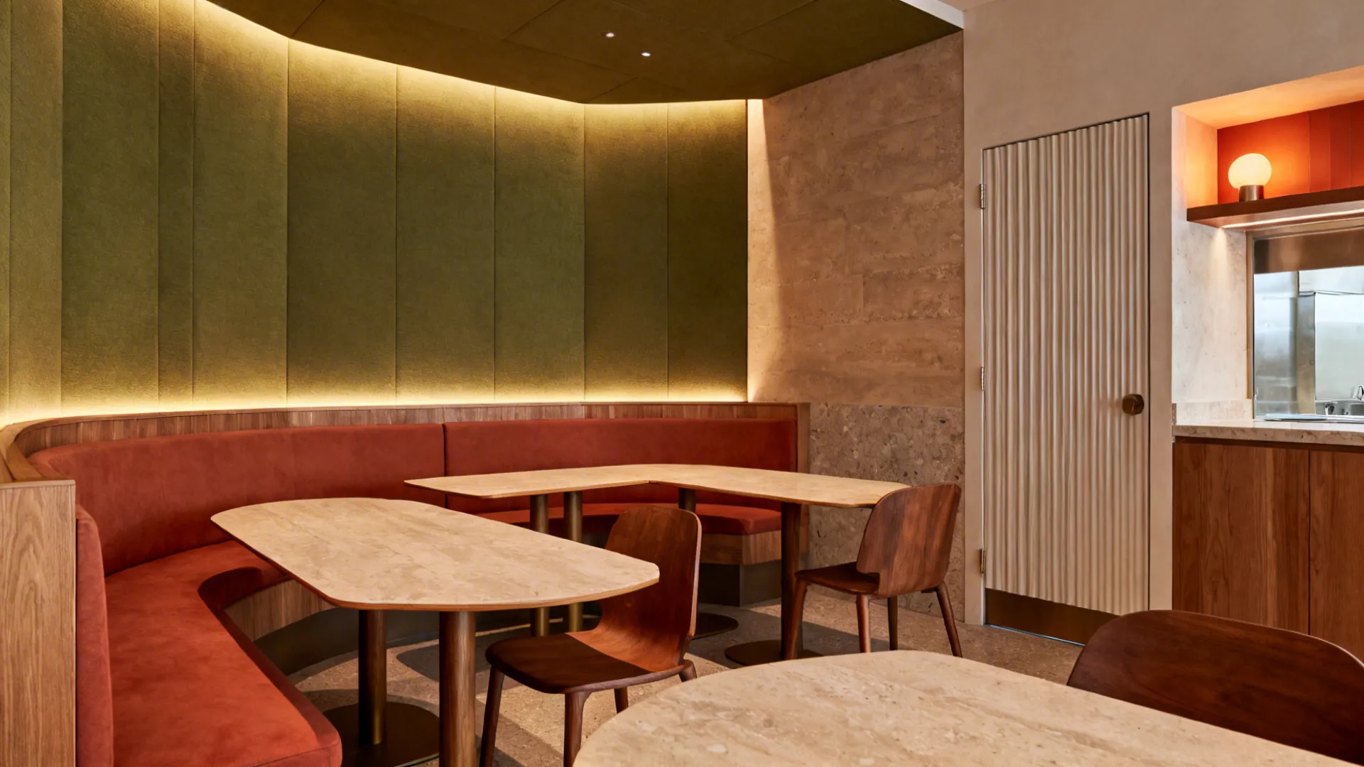 Wide view of a compact LA private dining room with warm materials, layered lighting, flexible seating, and hidden service nook.