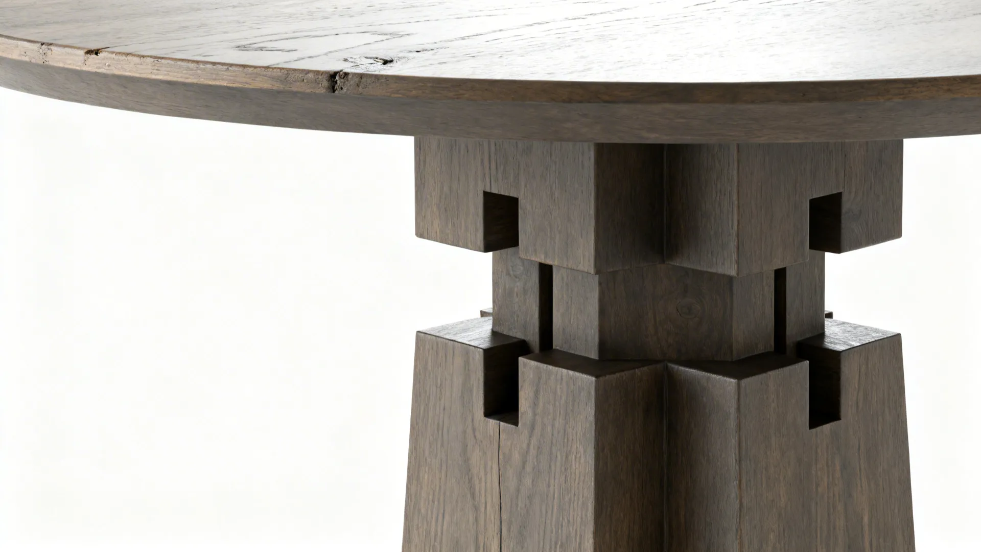 Close-up of a sturdy round pedestal base and matte wood tabletop edge.