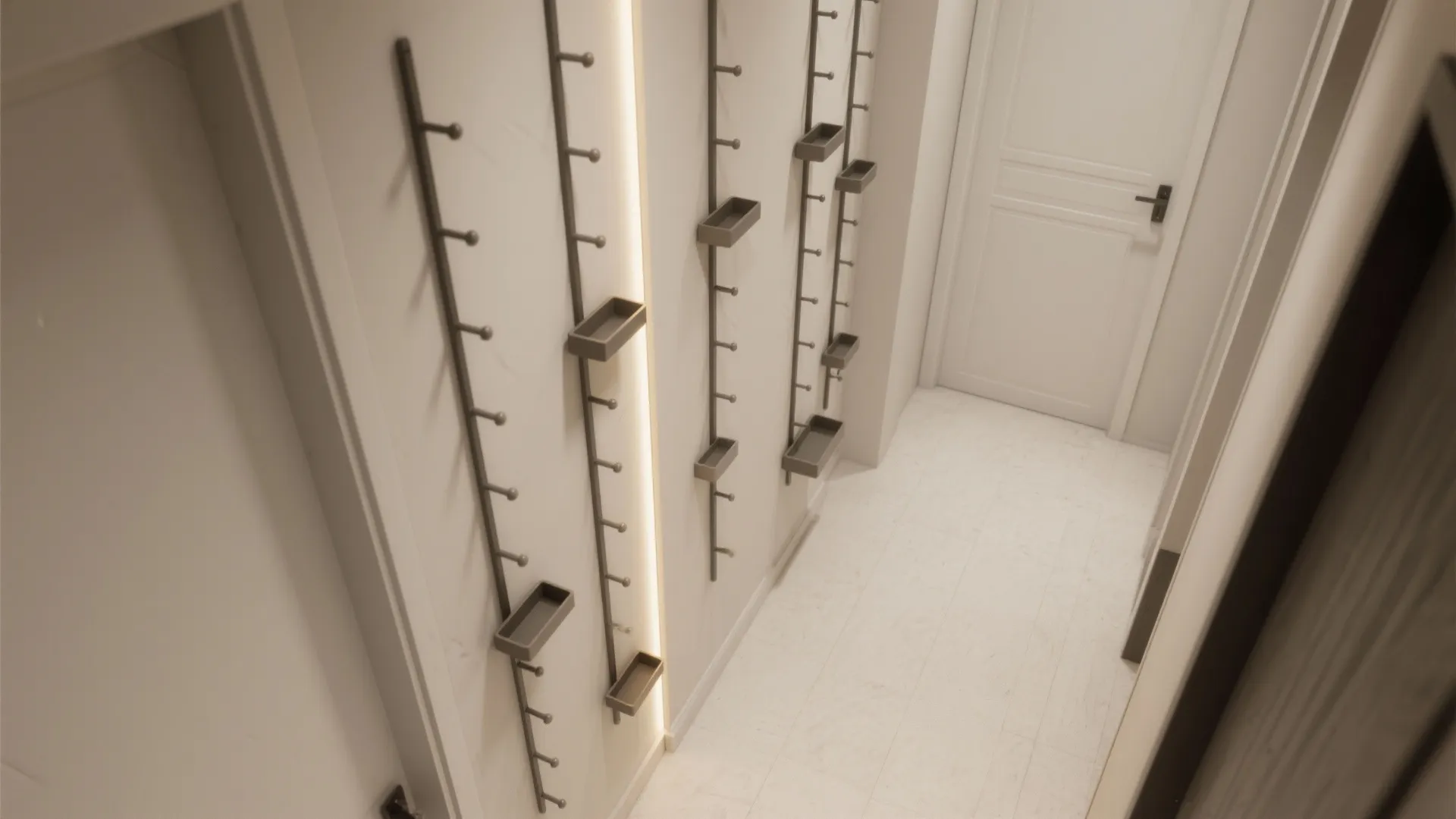 Top-down plan of hallway corner with peg rails on both walls and clear circulation.