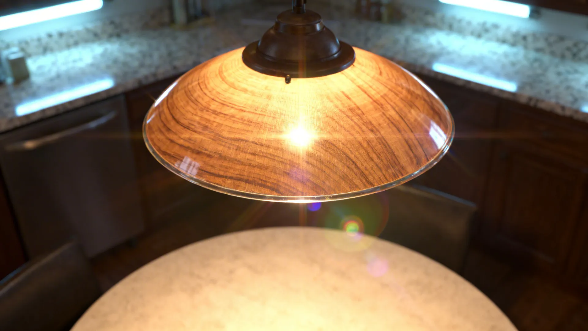 Close-up of a warm pendant casting soft light over a wood table.