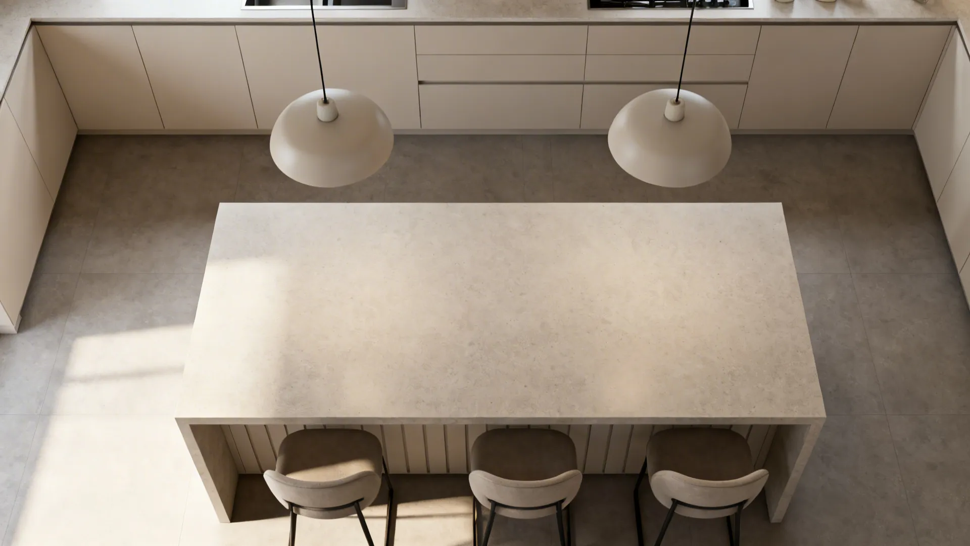 Top view of a kitchen island with three chairs and two round white ceiling lights