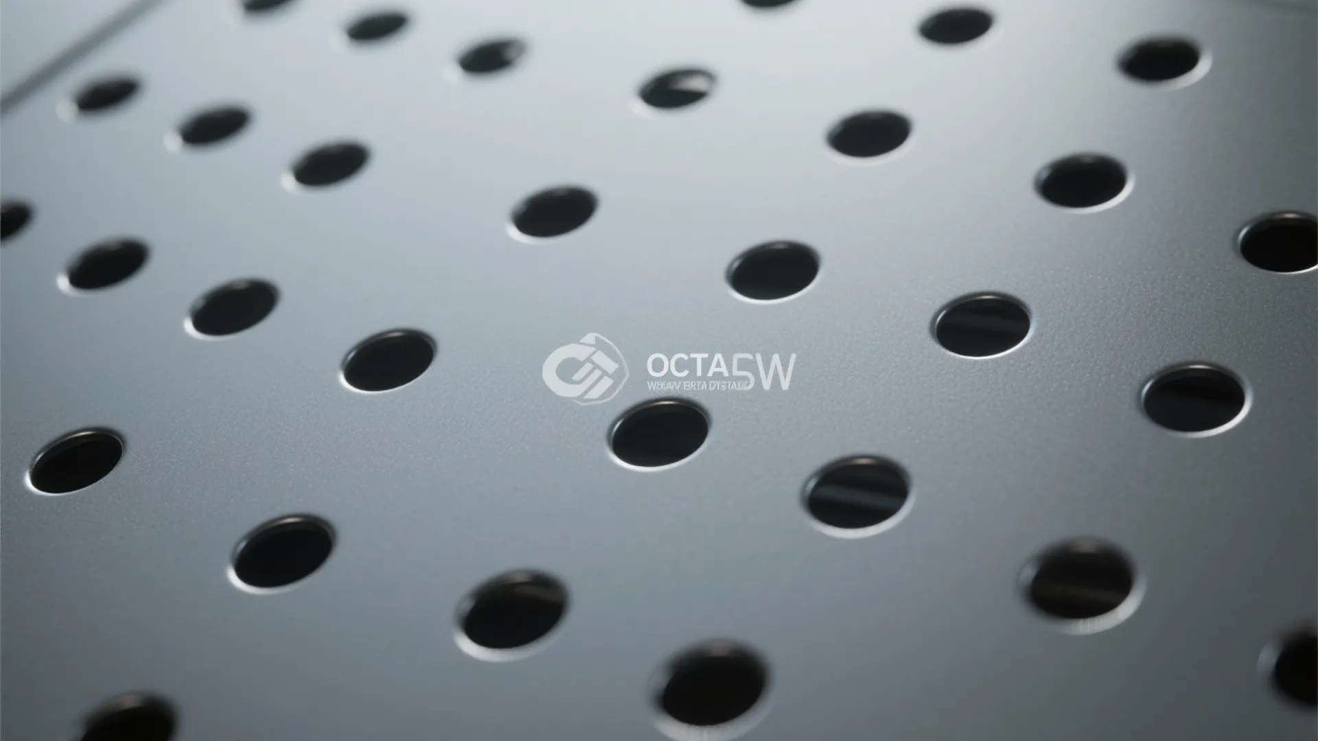 Close-up of a grey metal panel with small round holes used for modern interior design