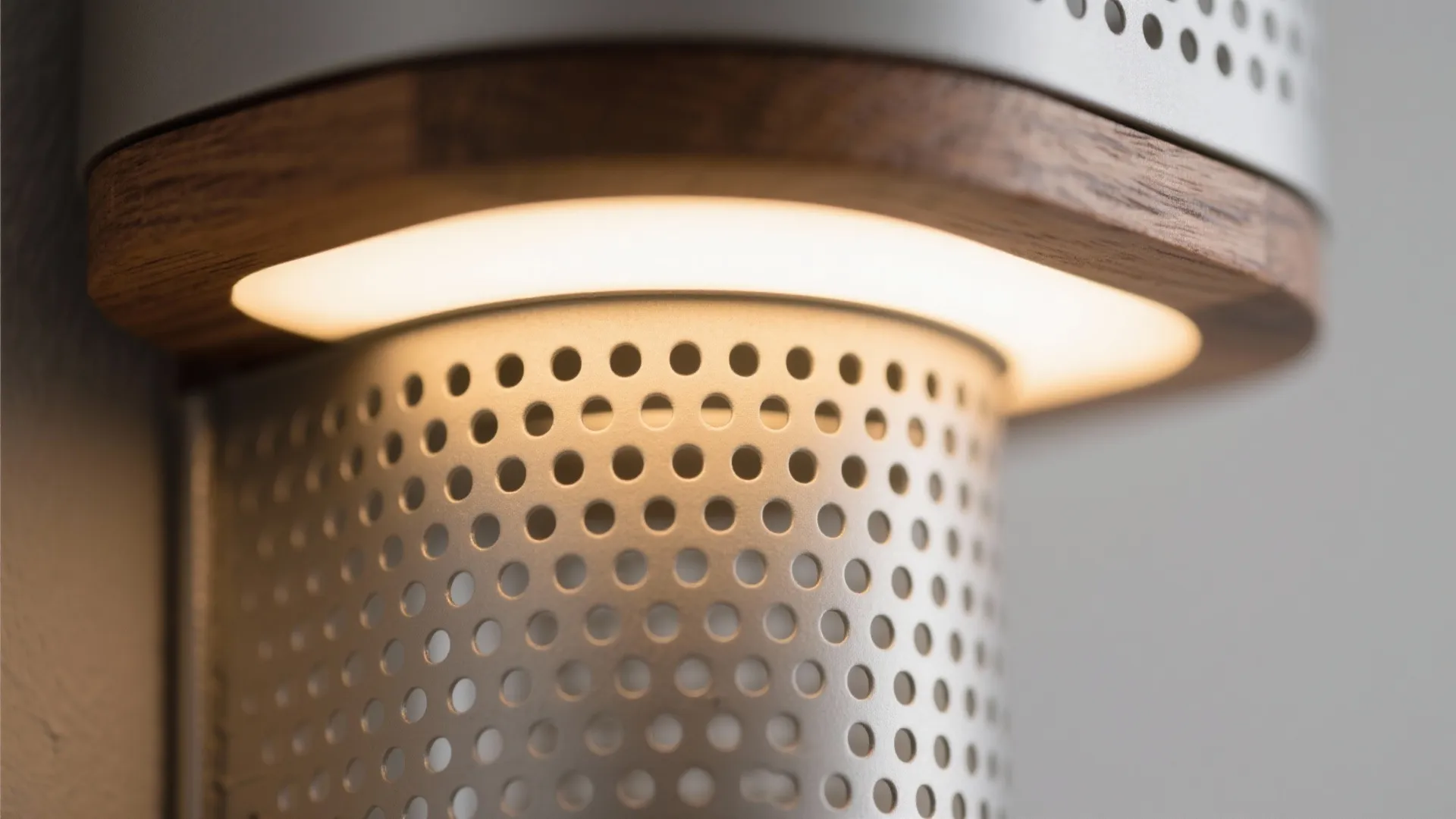 5) Warm wood accents and perforated shades for cozy texture