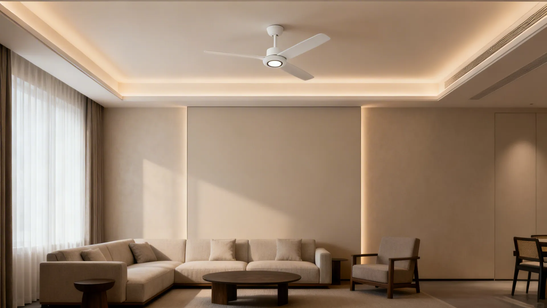 Floating perimeter cove with warm indirect light and a compact matte white fan on a simple medallion.