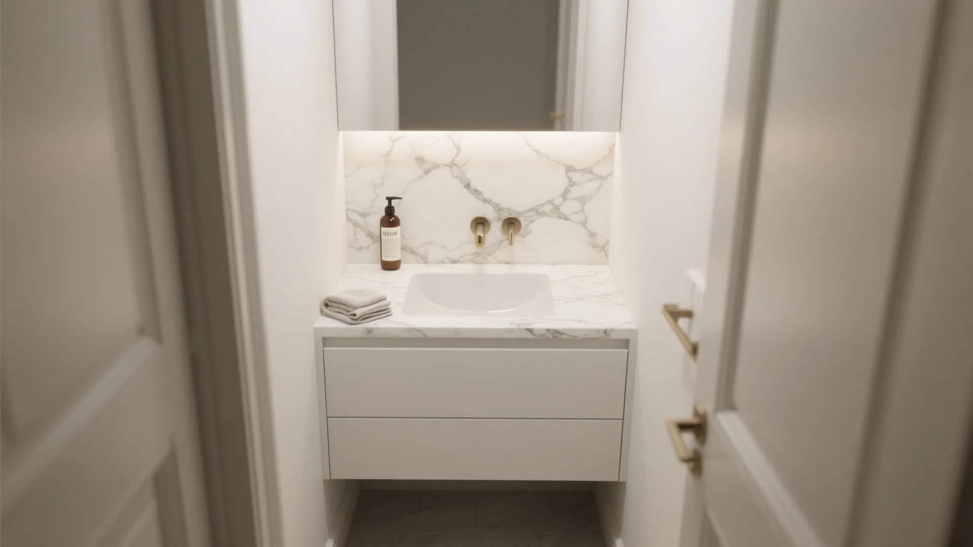 3. Petite single-sink vanity with integrated marble backsplash