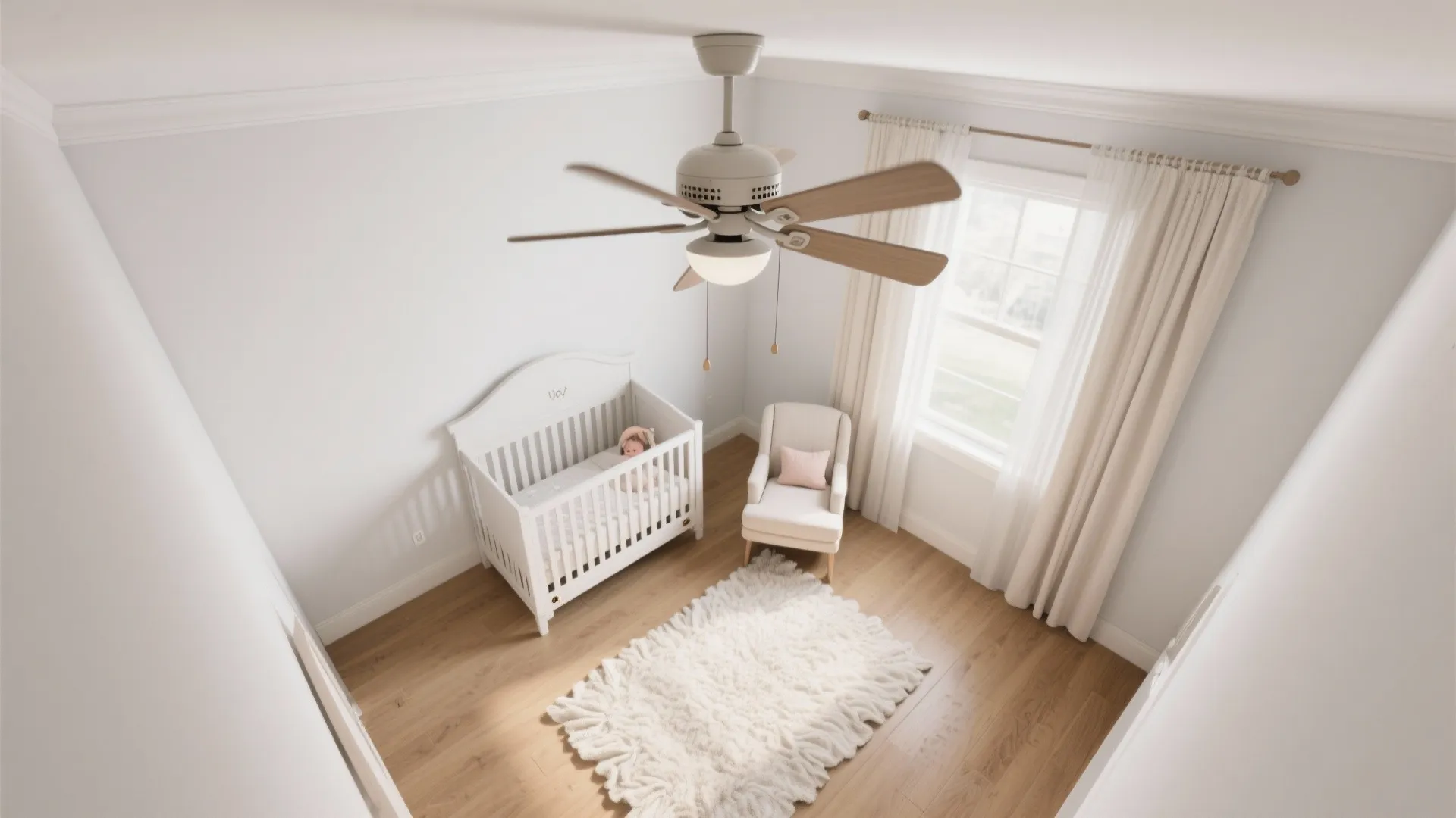 Top-down view of a 10x10 nursery with a 52-inch fan tuned for low-RPM, gentle airflow and quiet comfort.