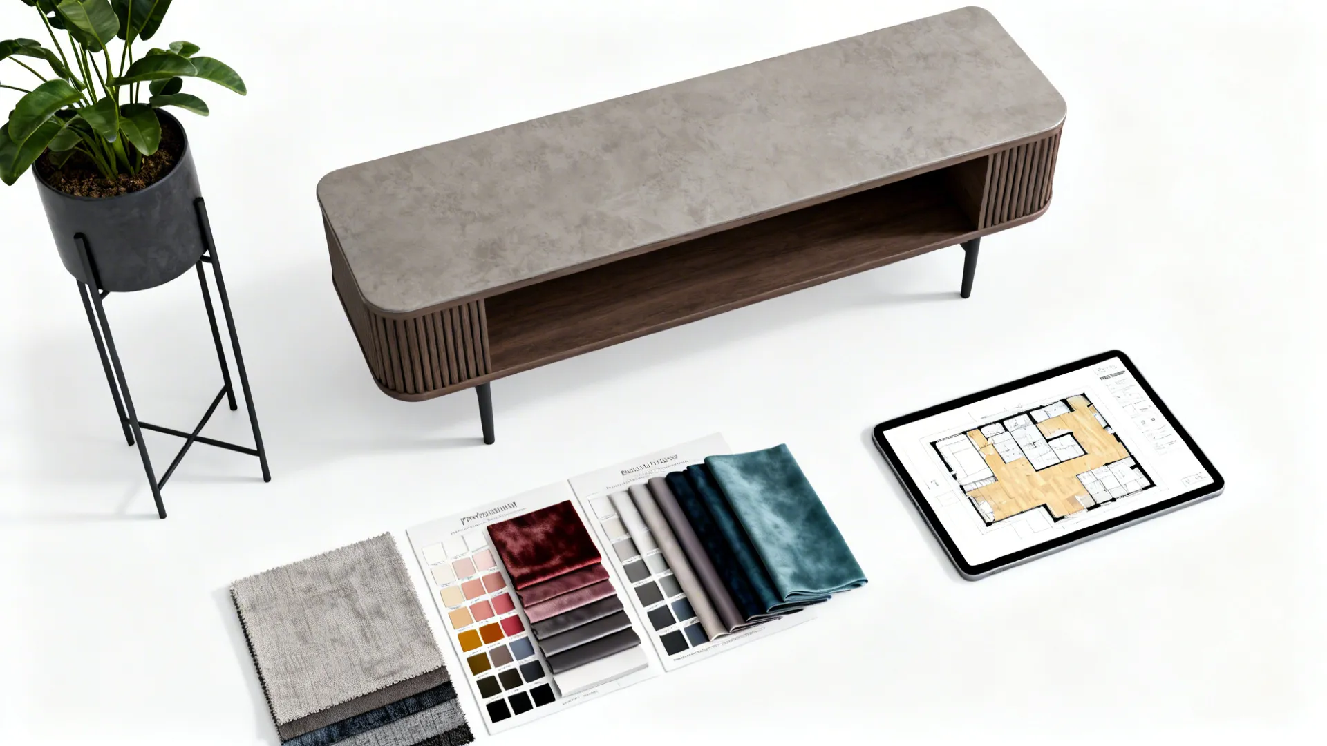 Top-down flatlay of fabric swatches, color cards and a tablet with a 3D floor planner for bean bag layout planning.