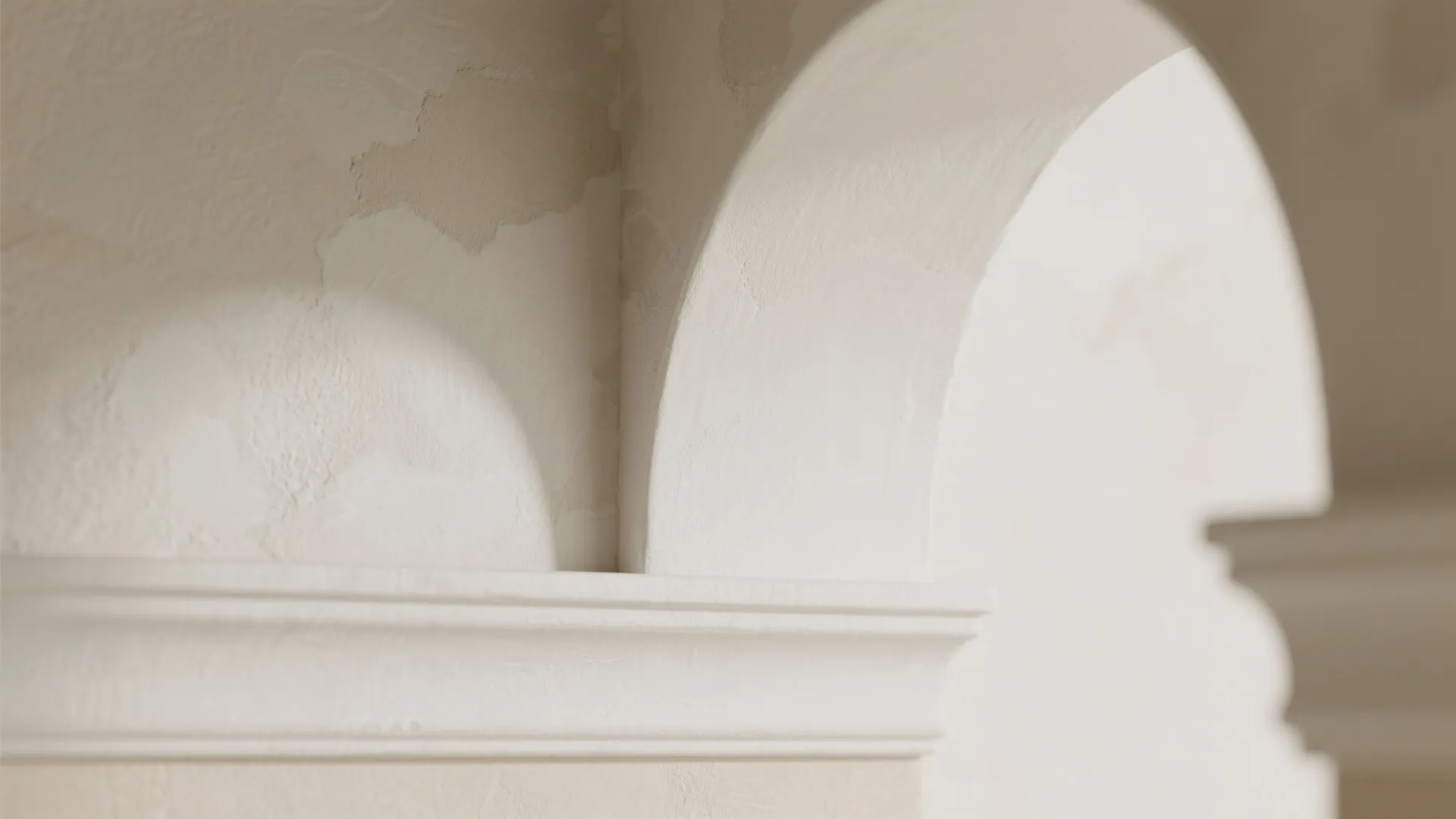Textured Plaster and Curved Trim to Elevate the Arch