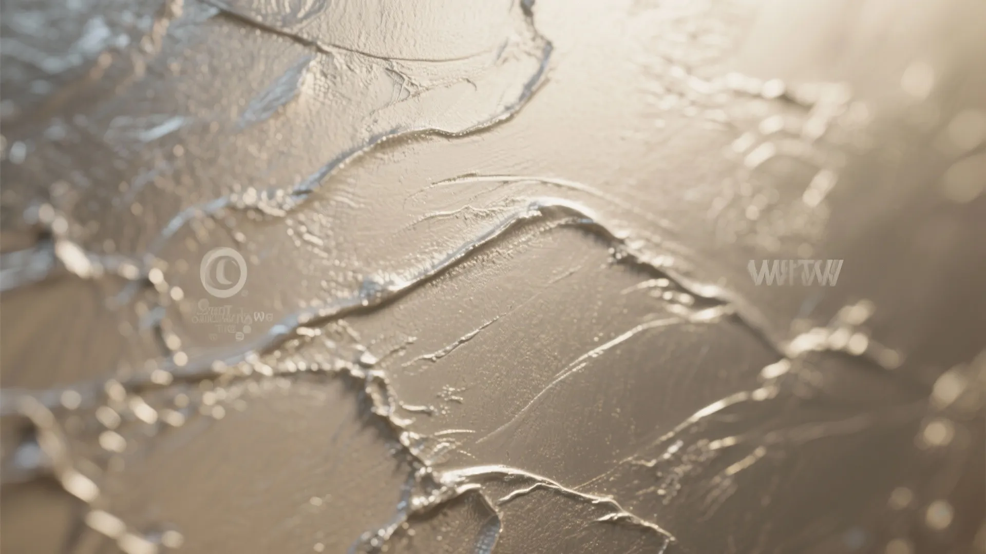 Close up of shiny wall paint showing thick texture and reflective light on a surface